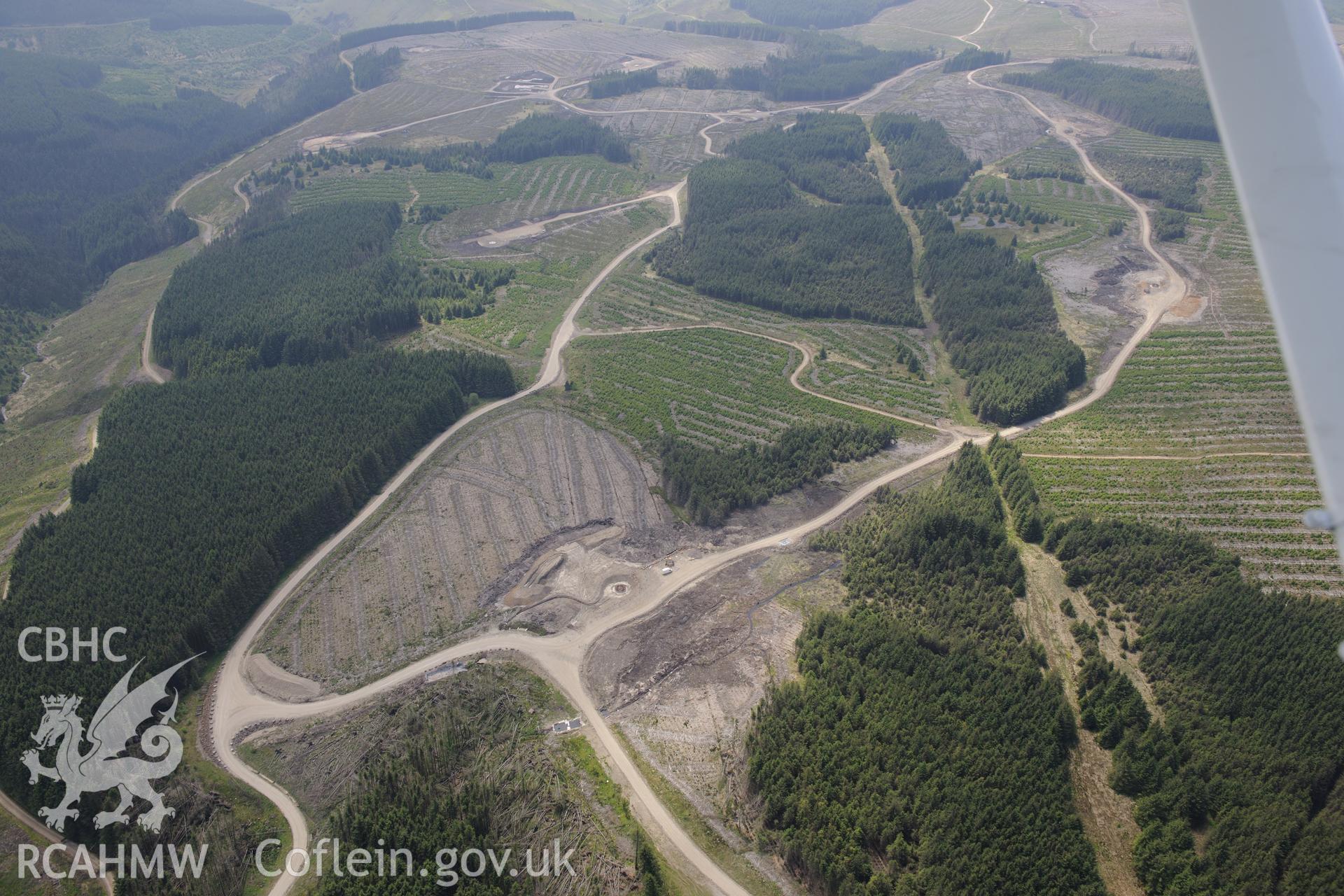 Pen y Cymoedd wind farm under construction before officially opening in September 2017.  Oblique aerial photograph taken during the Royal Commission's programme of archaeological aerial reconnaissance by Toby Driver on 11th June 2015.