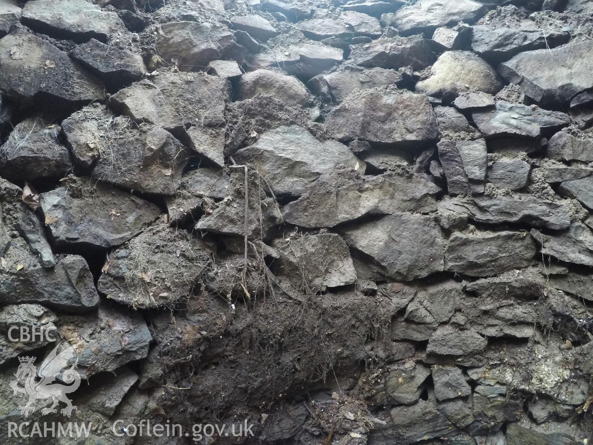 View from the east of well interior at 1.0m depth. Photographed by Gwynedd Archaeological Trust as part of archaeological mitigation report for well at Plas Celynin, Henryd, Conwy, on 1st August 2018. Project no. G2568.