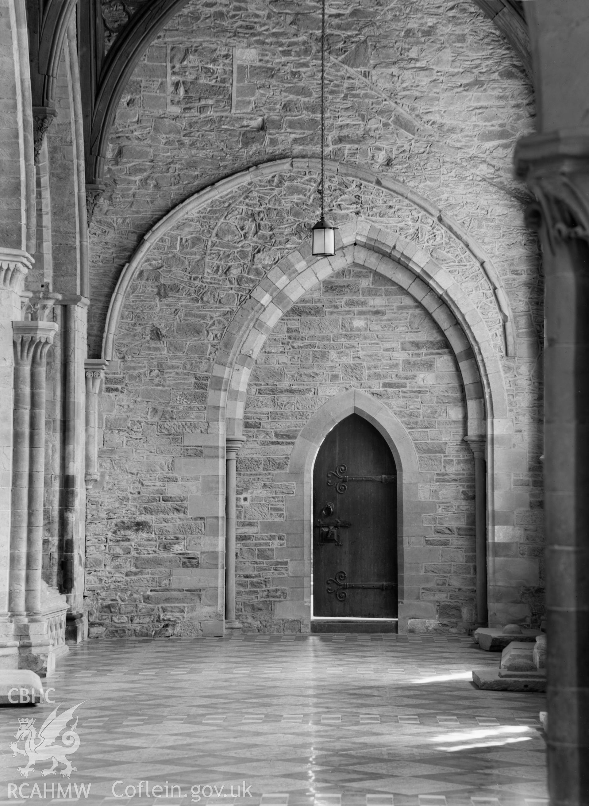 Digital copy of a black and white nitrate negative showing interior view of entrance at St. David's Cathedral, taken by E.W. Lovegrove, July 1936