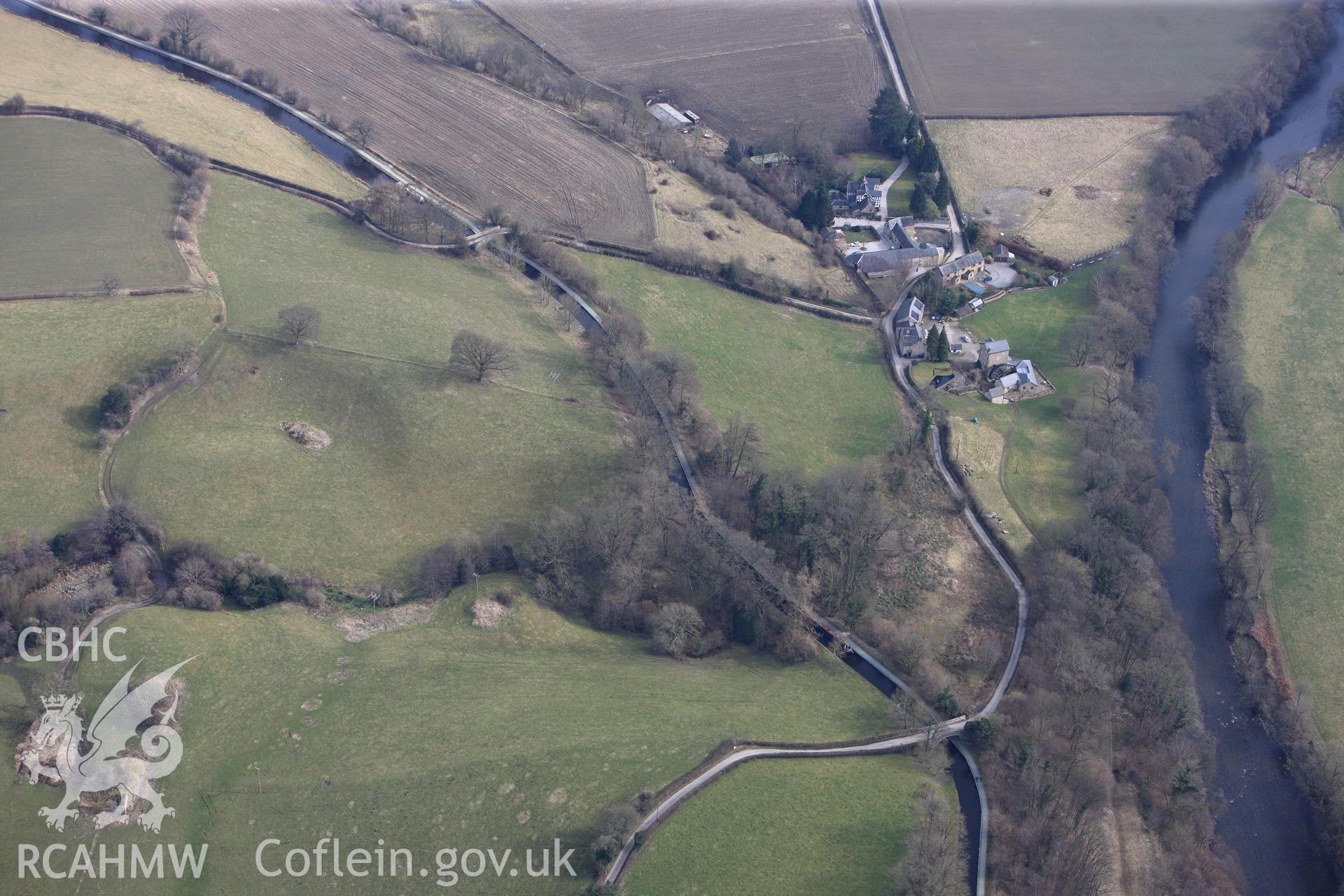 Trevor corn mill and Millars Bridge no. 35, crossing the Llangollen canal west of Froncysyllte. Oblique aerial photograph taken during the Royal Commission?s programme of archaeological aerial reconnaissance by Toby Driver on 28th February 2013.