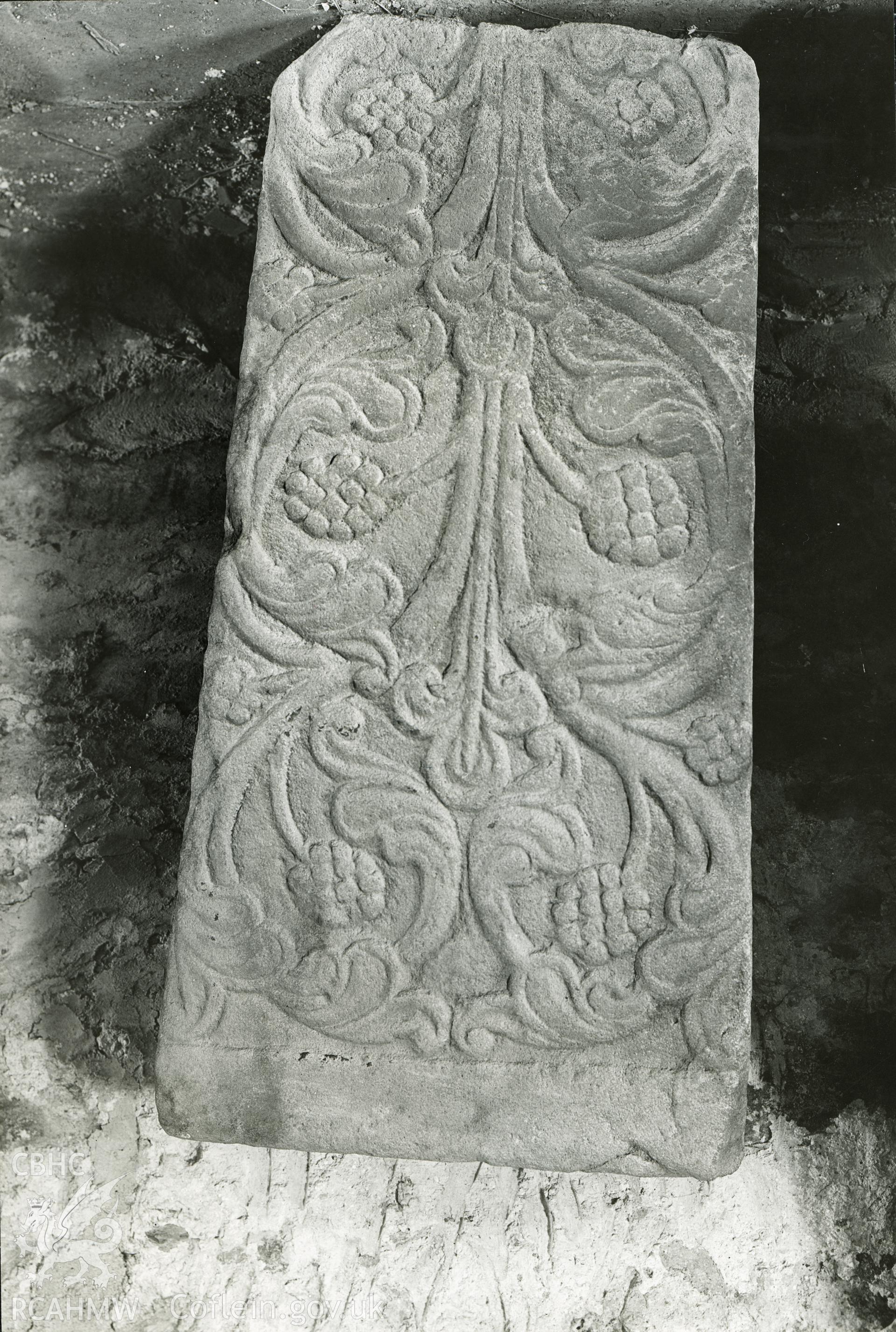 Digitised copy of a black and white print showing grave slab at Valle Crucis Abbey taken by F.H. Crossley, 1947. Negative held by NMR England.