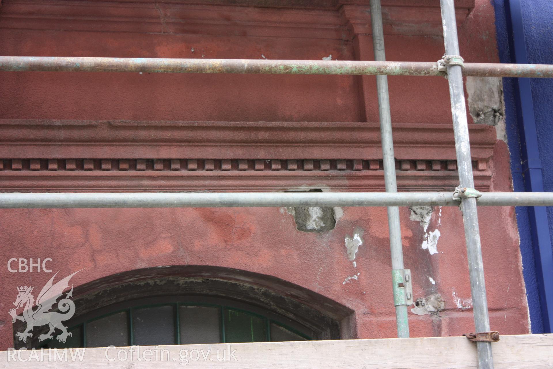 Colour photograph showing detail of exterior above ground floor door at the Old Auction Rooms/ Liberal Club in Aberystwyth. Photographic survey conducted by Geoff Ward on 9th June 2010 during repair work prior to conversion into flats.