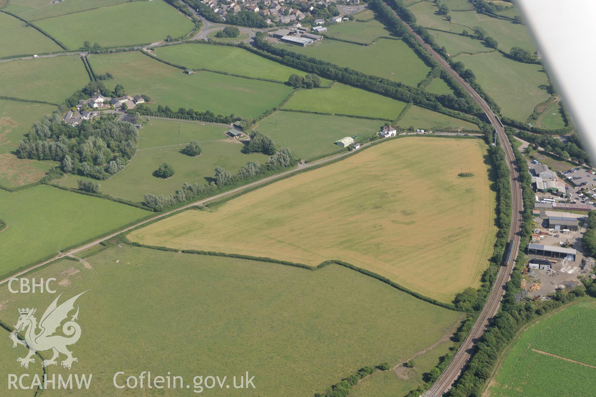 Caermead cropmark enclosure 2 (possible marching camp) and Morfa Lane cropmark enclosure, northwest of Llantwit Major. Oblique aerial photograph taken during RCAHMW?s programme of archaeological aerial reconnaissance by Toby Driver, 1st August 2013.