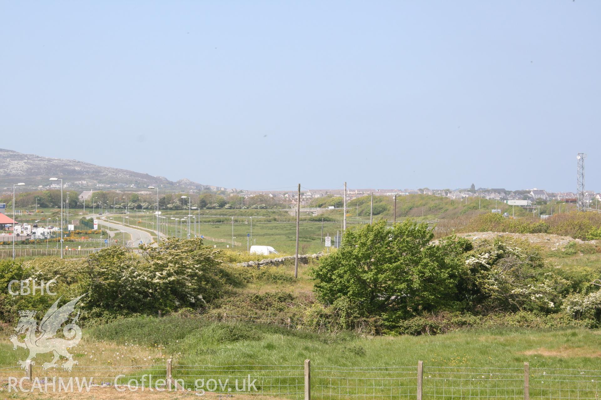 Shot, using slight camera zoom, towards Ty-Mawr Standing Stone & the development site. Looking northwest. Digital photograph taken for archaeological work at Parc Cybi Enterprise Zone, Holyhead, carried out by Archaeology Wales, 2017. Project no: P2522.