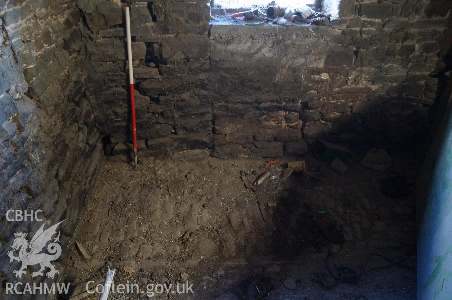 View 'looking east southeast at the northeast corner of the stable, showing cobbled floor' on Gwrlodau Farm, Llanbedr, Crickhowell. Photograph and description by Jenny Hall and Paul Sambrook of Trysor, 9th February 2018.