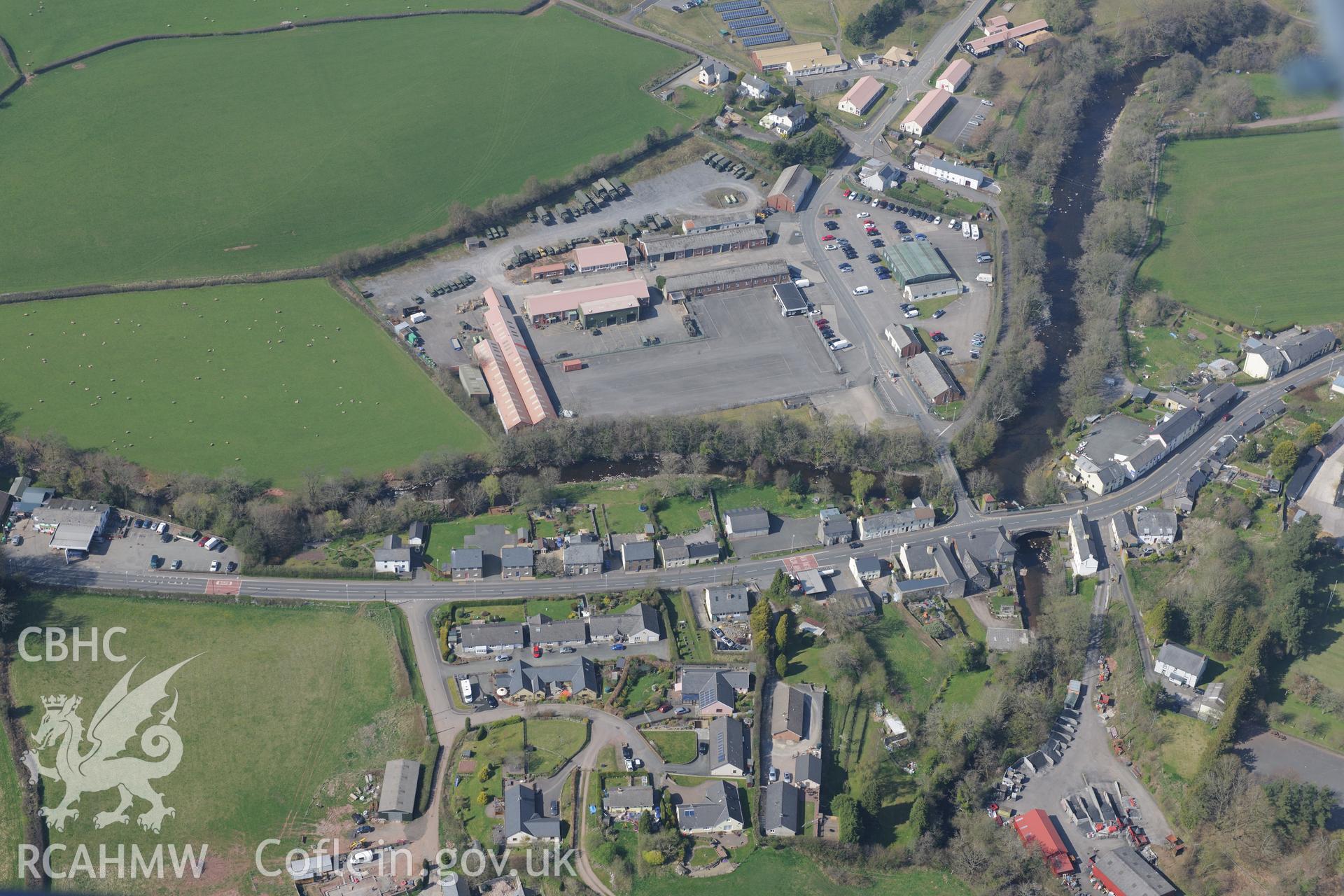 Sennybridge Village including the castle, Sion Baptist Chapel, Sennybridge Camp and coal yard. Oblique aerial photograph taken during the Royal Commission's programme of archaeological aerial reconnaissance by Toby Driver on 21st April 2015