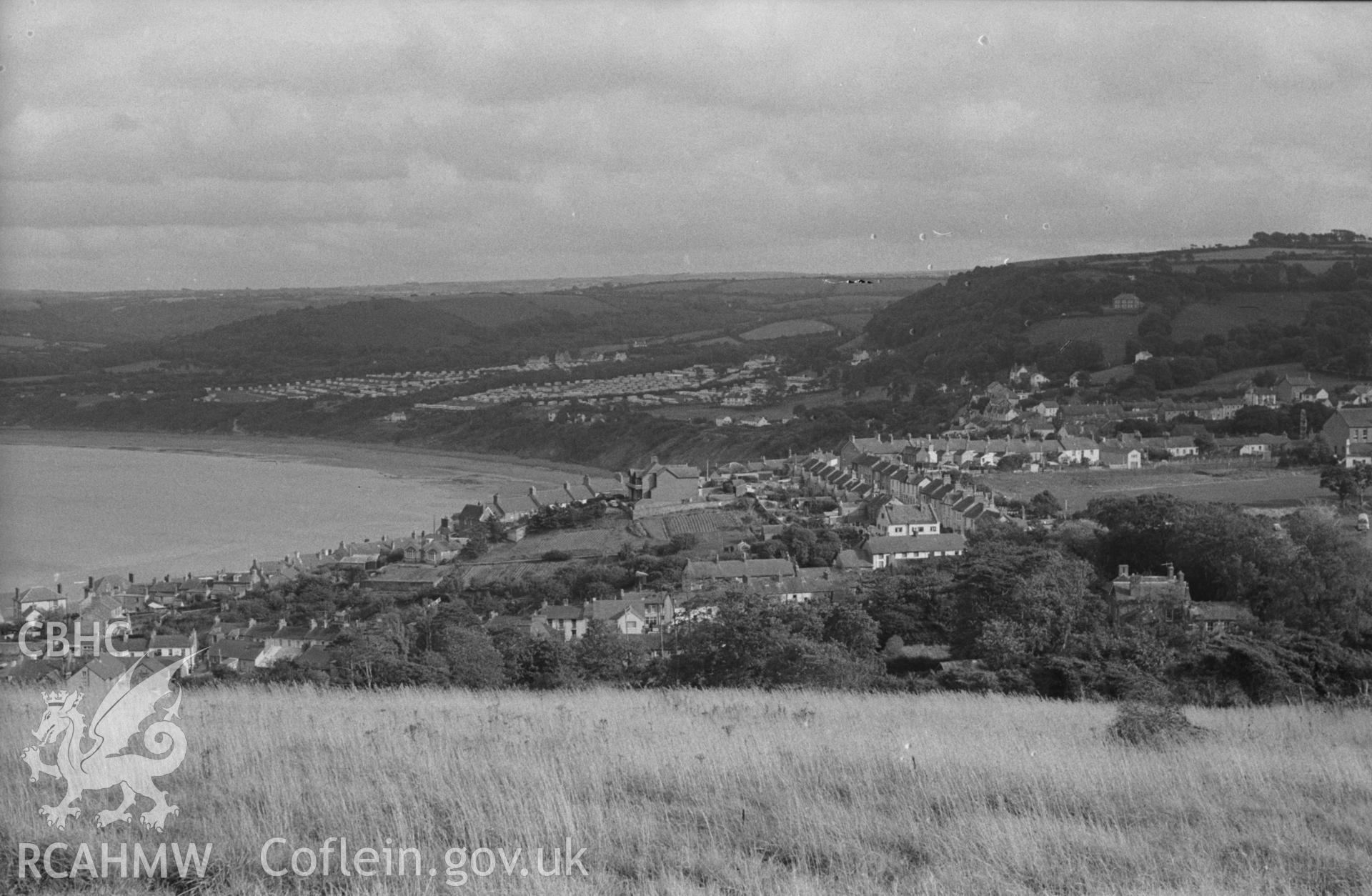 Digital copy of a black and white negative showing New Quay from near the Signal Station on New Quay Head. Photographed by Arthur O. Chater in September 1964 from Grid Reference SN 385 603, looking south east.