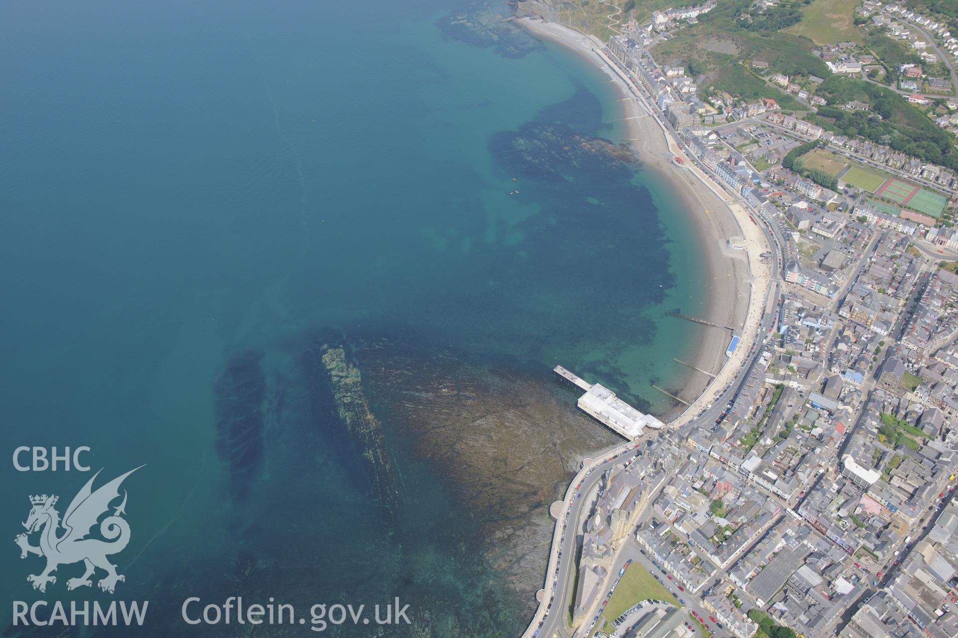 The Royal Pier and Pavilion and the promenade at Aberystwyth. Oblique aerial photograph taken during the Royal Commission?s programme of archaeological aerial reconnaissance by Toby Driver on 12th July 2013.