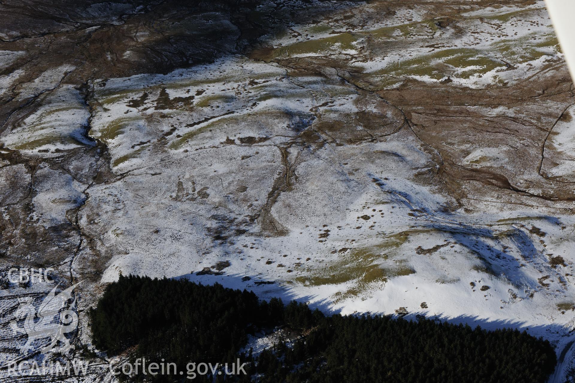 Blaen Glasffrwd cairn, south east of Pontrhydfendigaid. Oblique aerial photograph taken during the Royal Commission's programme of archaeological aerial reconnaissance by Toby Driver on 4th February 2015.