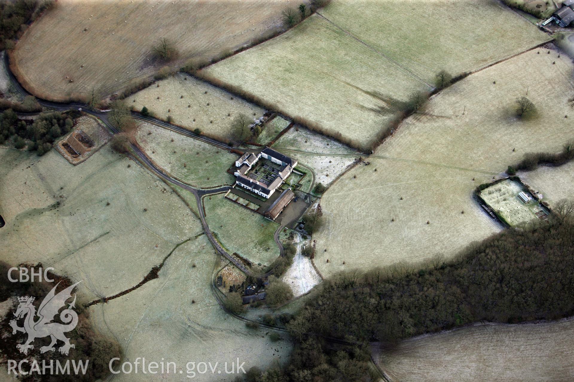 Llwynywormwood garden and farmstead, including barn, south of Llandovery. Oblique aerial photograph taken during the Royal Commission?s programme of archaeological aerial reconnaissance by Toby Driver on 15th January 2013.