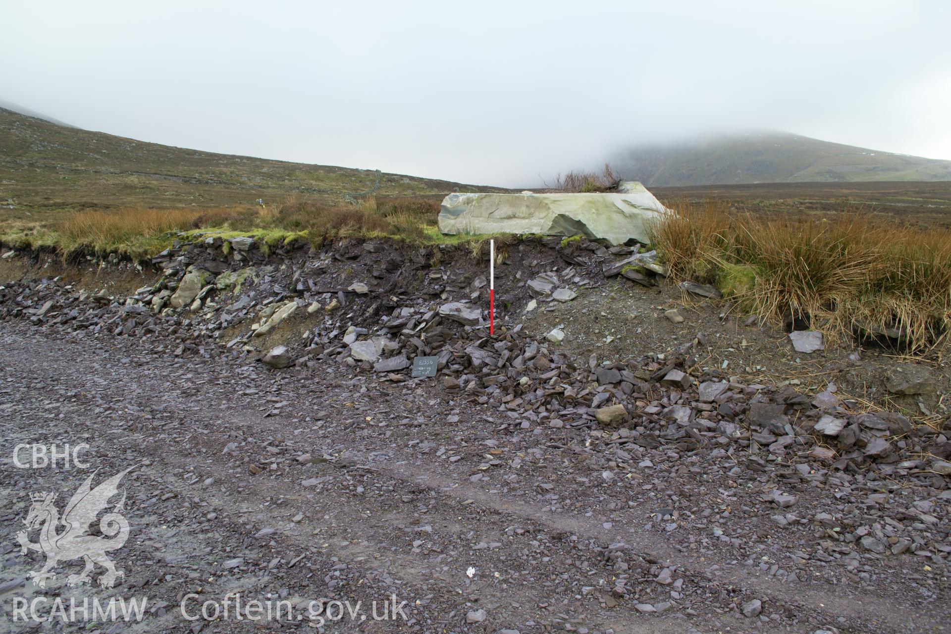 Angled view from the west 'of Linear 01 cut through trackway.' Photographed by Gwynedd Archaeological Trust as part of walkover survey of Penrhyn Quarry, Bethesda, on 20th February 2018. Project no. G2556.