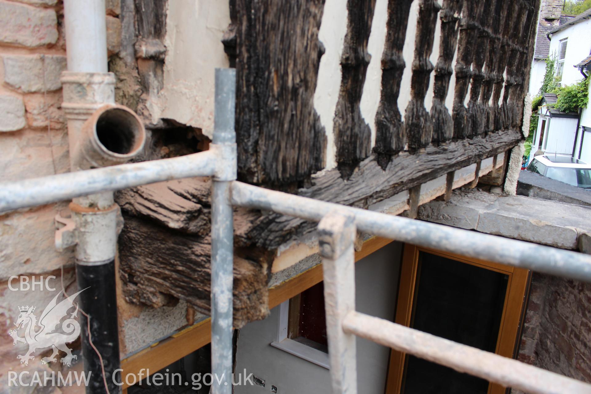 Colour photograph showing detailed view of section of 17th century balcony ballustrading embedded in southeast corner of Porth y Dwr, Clwyd Street, Ruthin. Photograph taken during survey conducted by Geoff Ward on 9th October 2014.