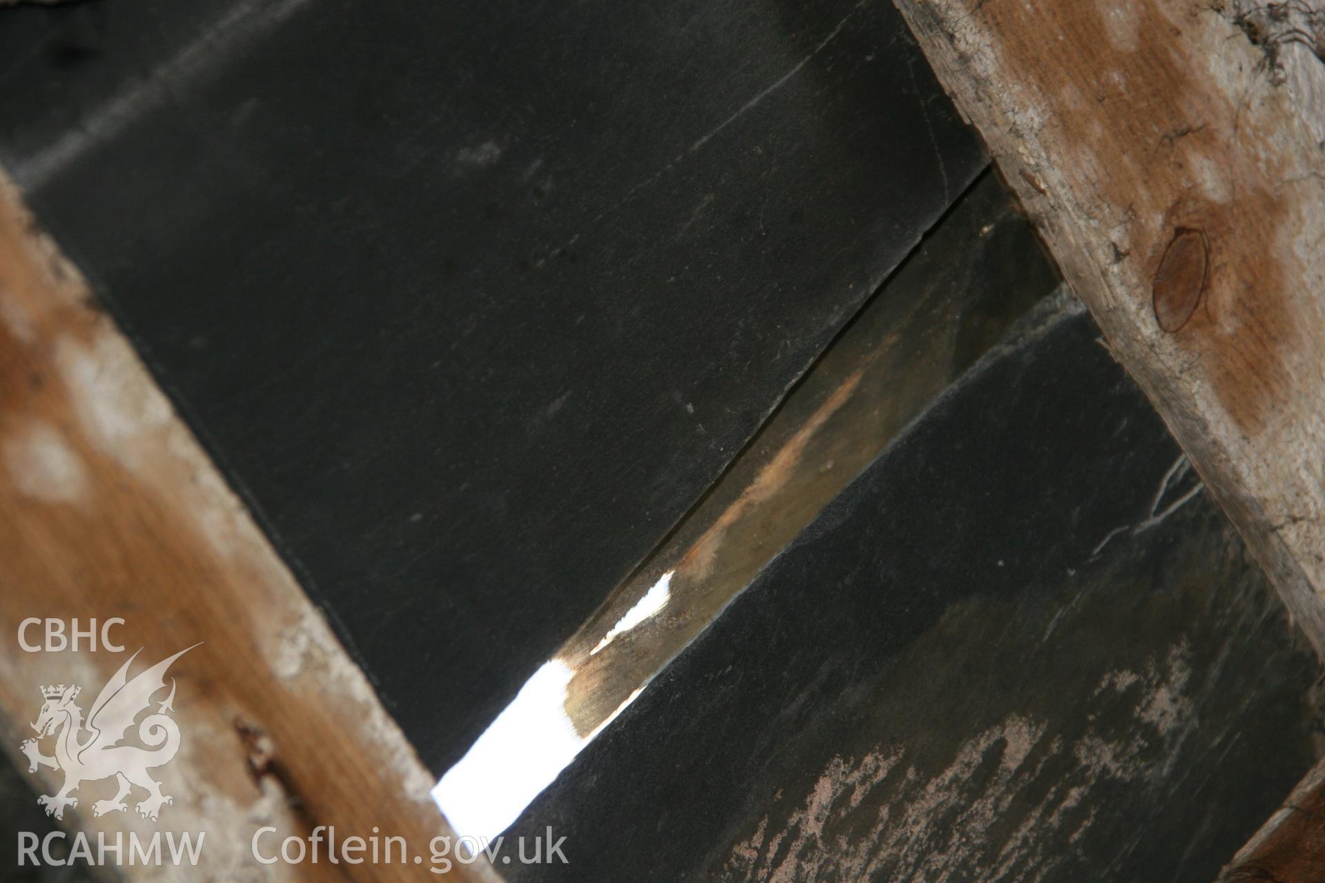 Photograph showing detailed interior view of exposed slate tile in the roof of the former Llawrybettws Welsh Calvinistic Methodist chapel, Glanyrafon, Corwen. Produced by Tim Allen on 27th February 2019 to meet a condition attached to planning application.