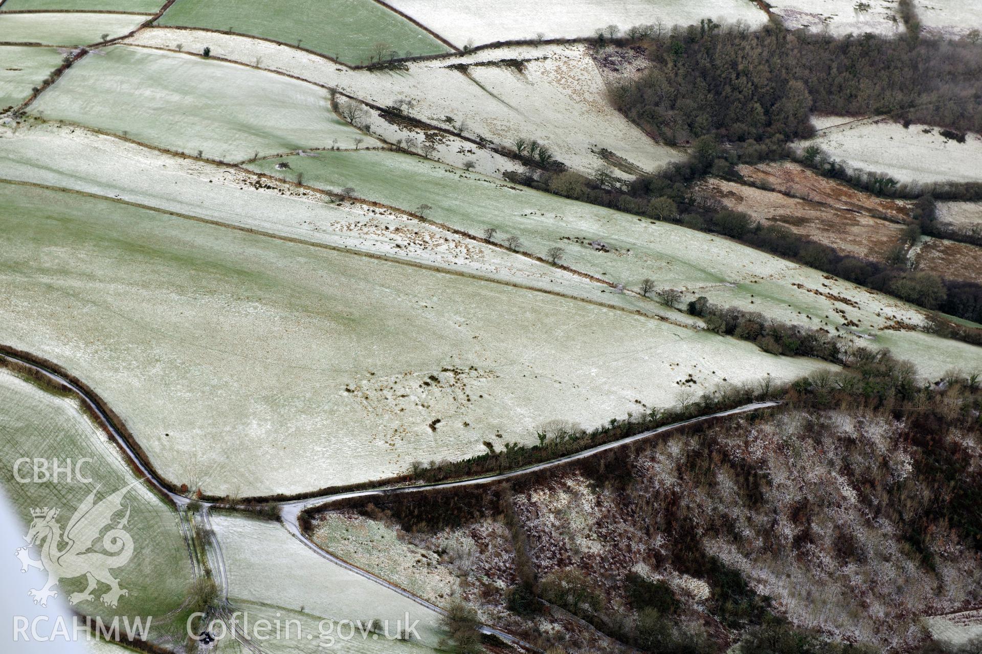 Possible Roman fortlet or enclosure at Cwmargenau, Llanwrda, west of Llandovery. Oblique aerial photograph taken during the Royal Commission?s programme of archaeological aerial reconnaissance by Toby Driver on 15th January 2013.