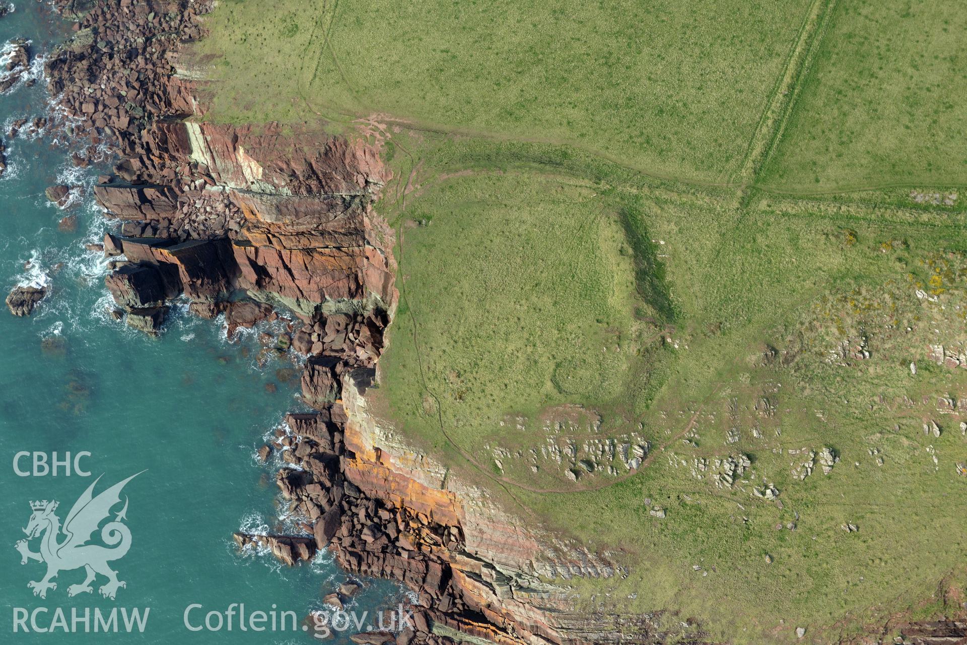 Aerial photography of West Pickard Bay promontory fort taken on 27th March 2017. Baseline aerial reconnaissance survey for the CHERISH Project. ? Crown: CHERISH PROJECT 2019. Produced with EU funds through the Ireland Wales Co-operation Programme 2014-2020. All material made freely available through the Open Government Licence.