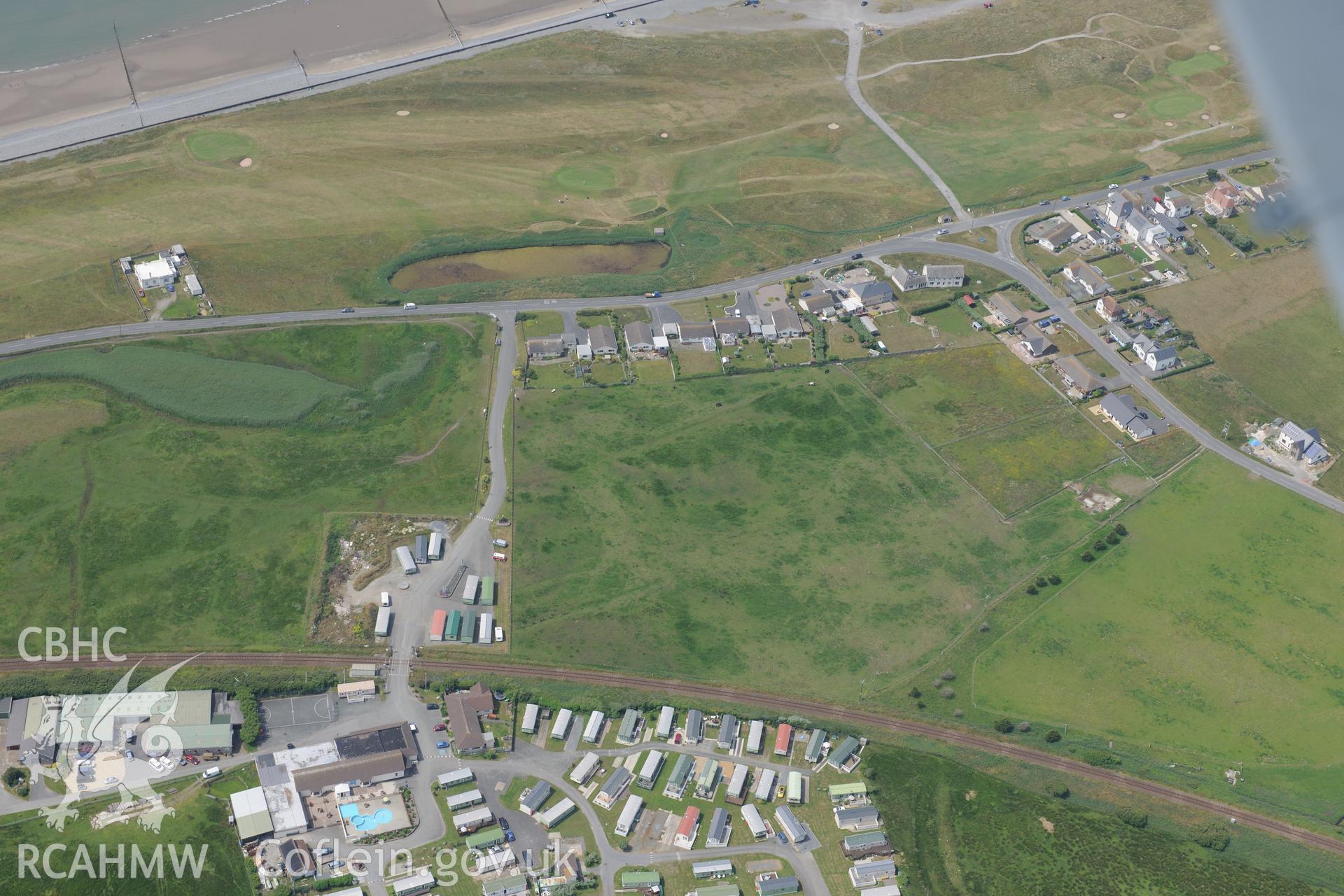 The village of Ynys Las, Ceredigion. Oblique aerial photograph taken during the Royal Commission?s programme of archaeological aerial reconnaissance by Toby Driver on 12th July 2013.