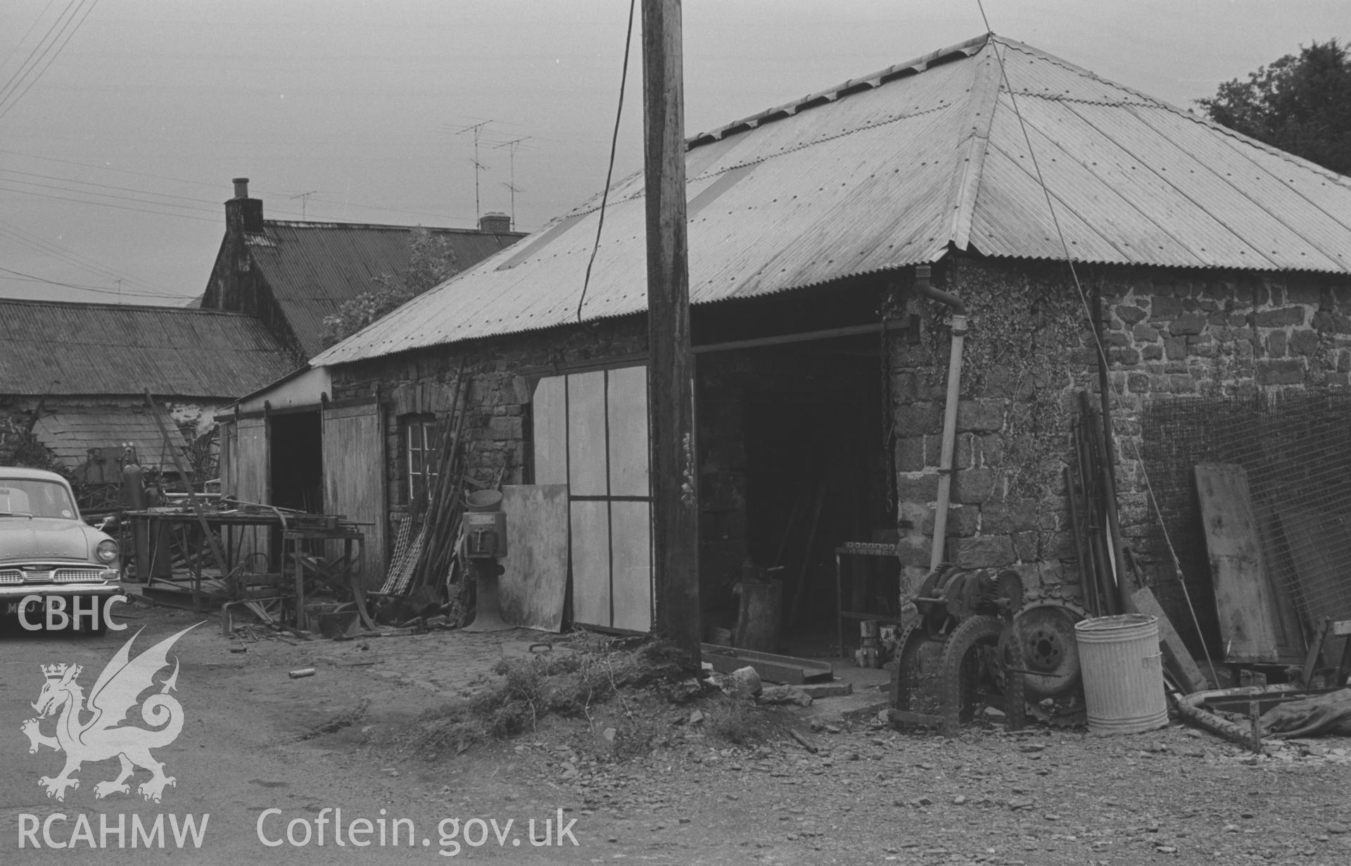 Digital copy of a black and white negative showing forge on the east side of the road at the south end of Talsarn, south east of Aberaeron. Photographed by Arthur O. Chater on 5th September 1966 looking north east from Grid Reference SN 545 563.