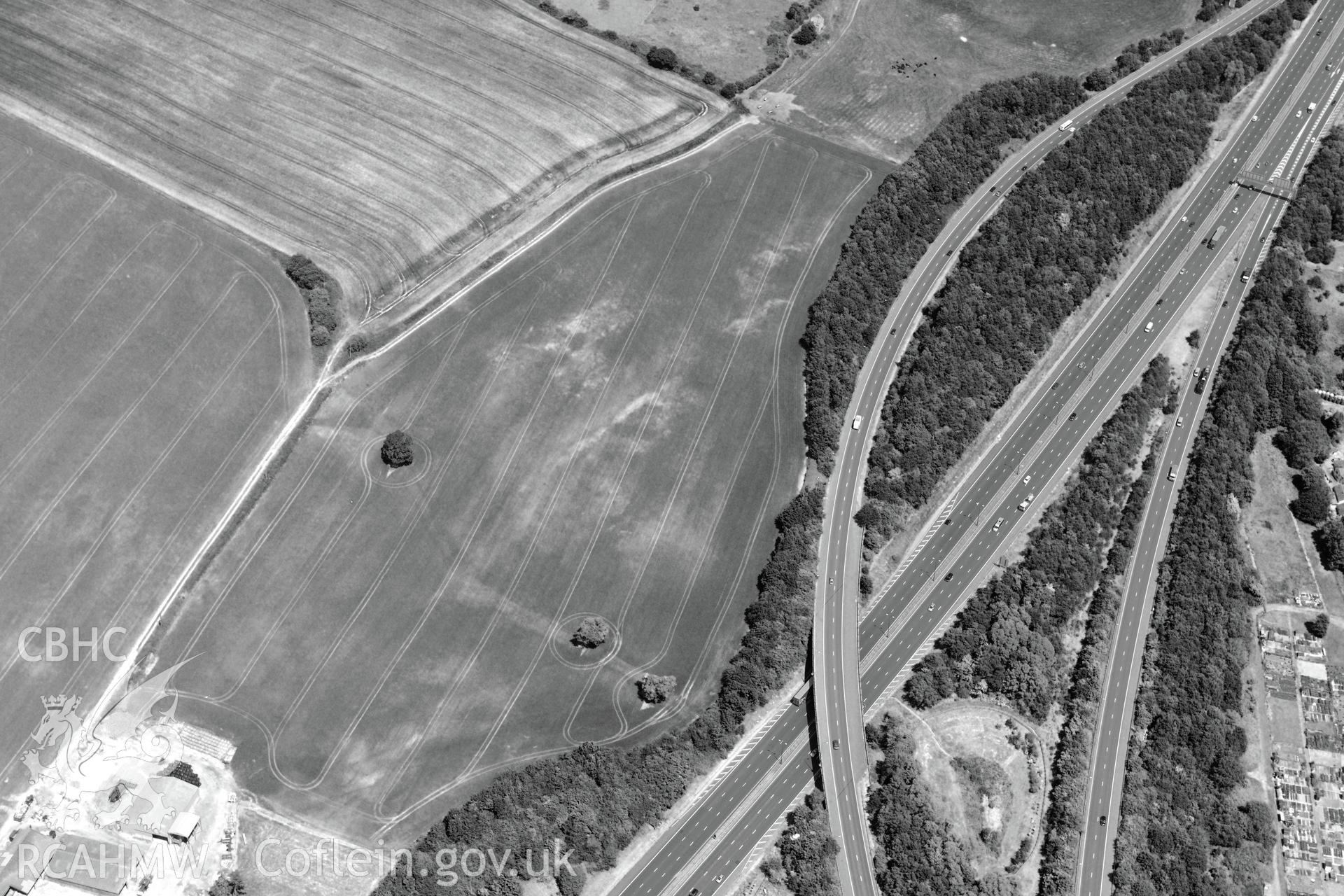 Cropmark enclosure east of New Park, near Junction 29 of the M4, Castleton. Oblique aerial photograph taken during the Royal Commission's programme of archaeological aerial reconnaissance by Toby Driver on 29th June 2015.