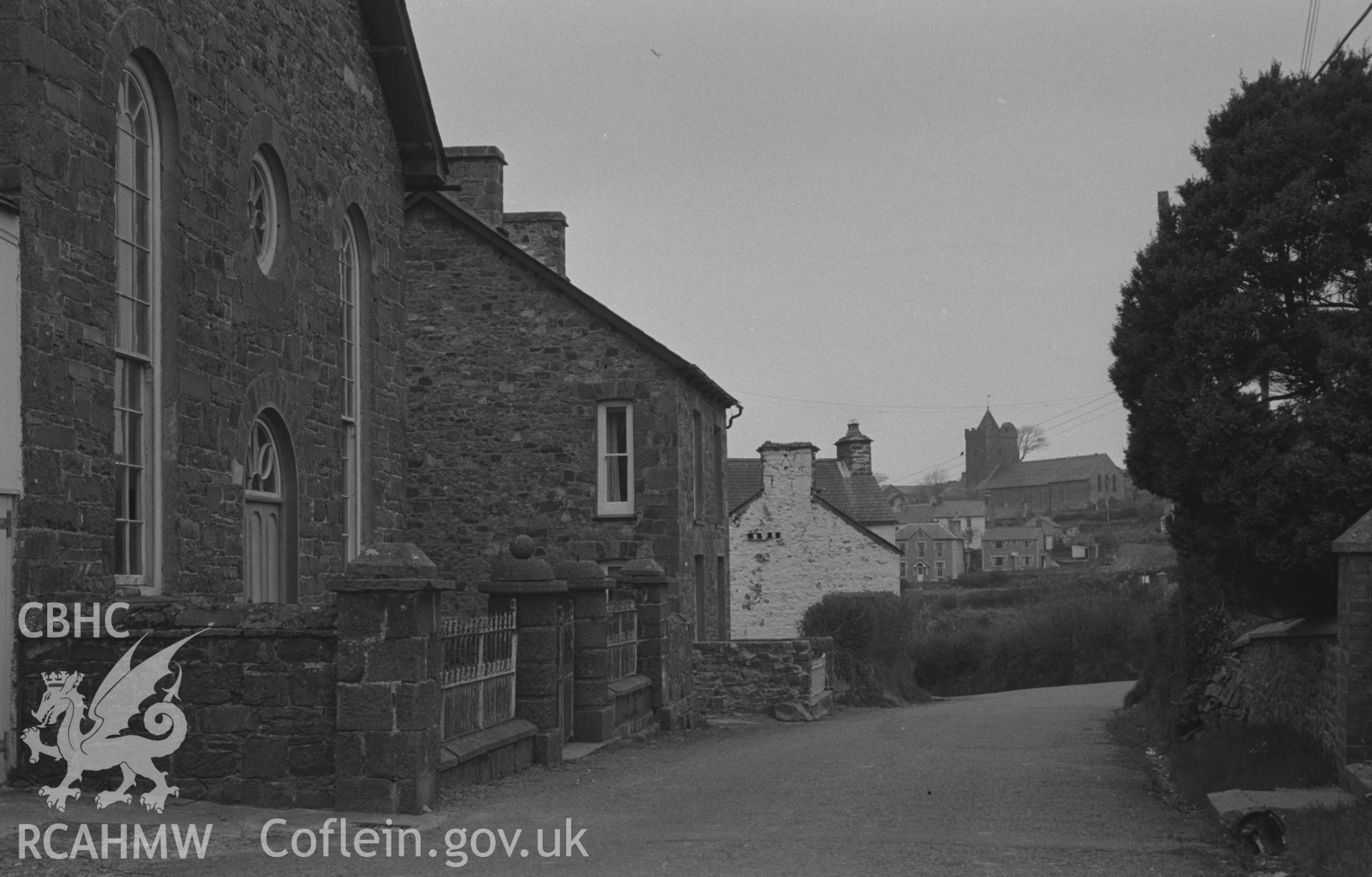 Digital copy of a black and white negative showing Fronwen Welsh Calvinistic Methodist Chapel with church beyond, and other buildings in Llanarth. Photographed by Arthur O. Chater on 13th April 1967 looking west from Grid Reference SN 425 577.