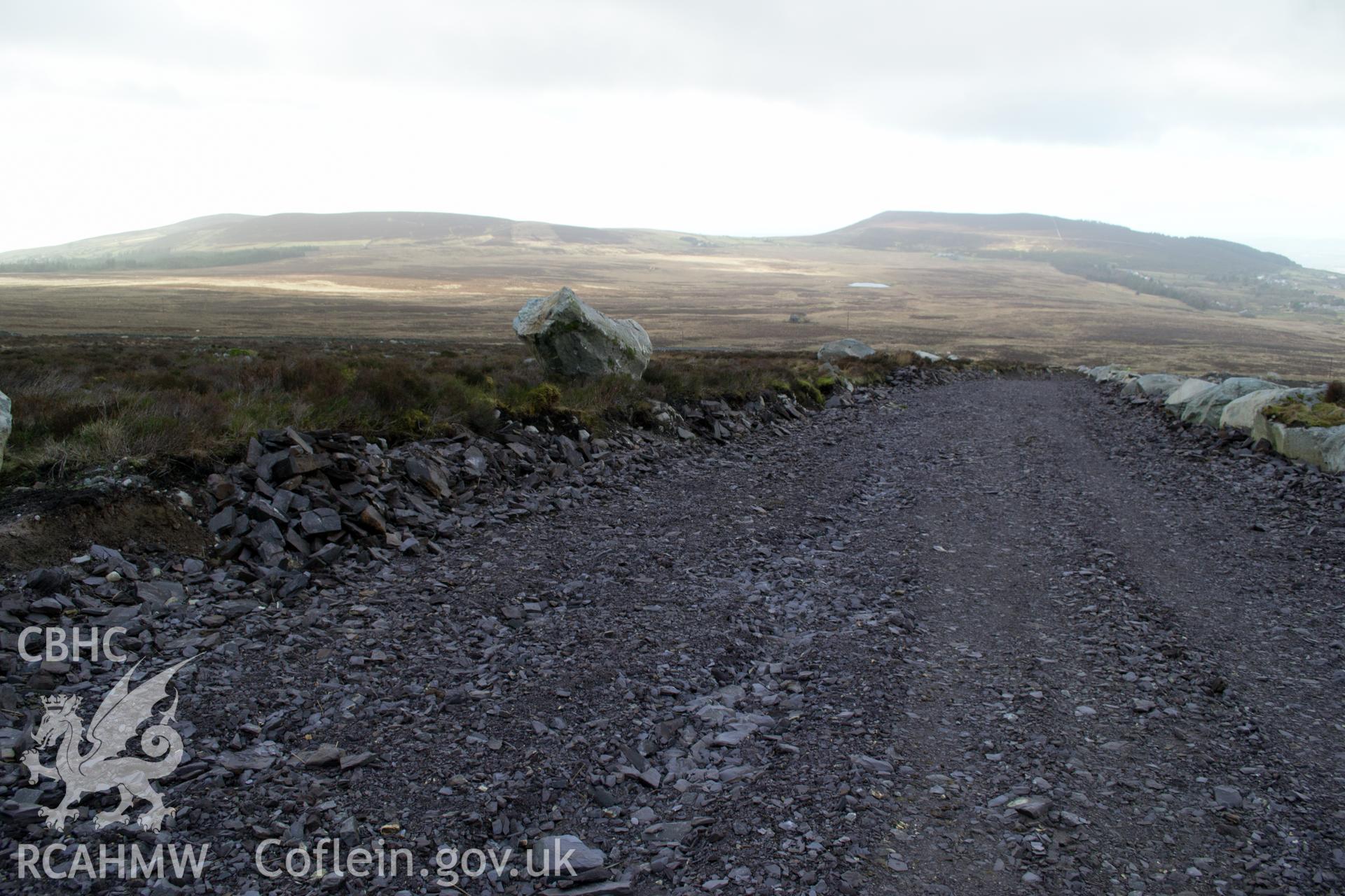 General view from north west 'showing haul road and cut through linears.' Photographed by Gwynedd Archaeological Trust as part of walkover survey of Penrhyn Quarry, Bethesda, on 20th February 2018. Project no. G2556.