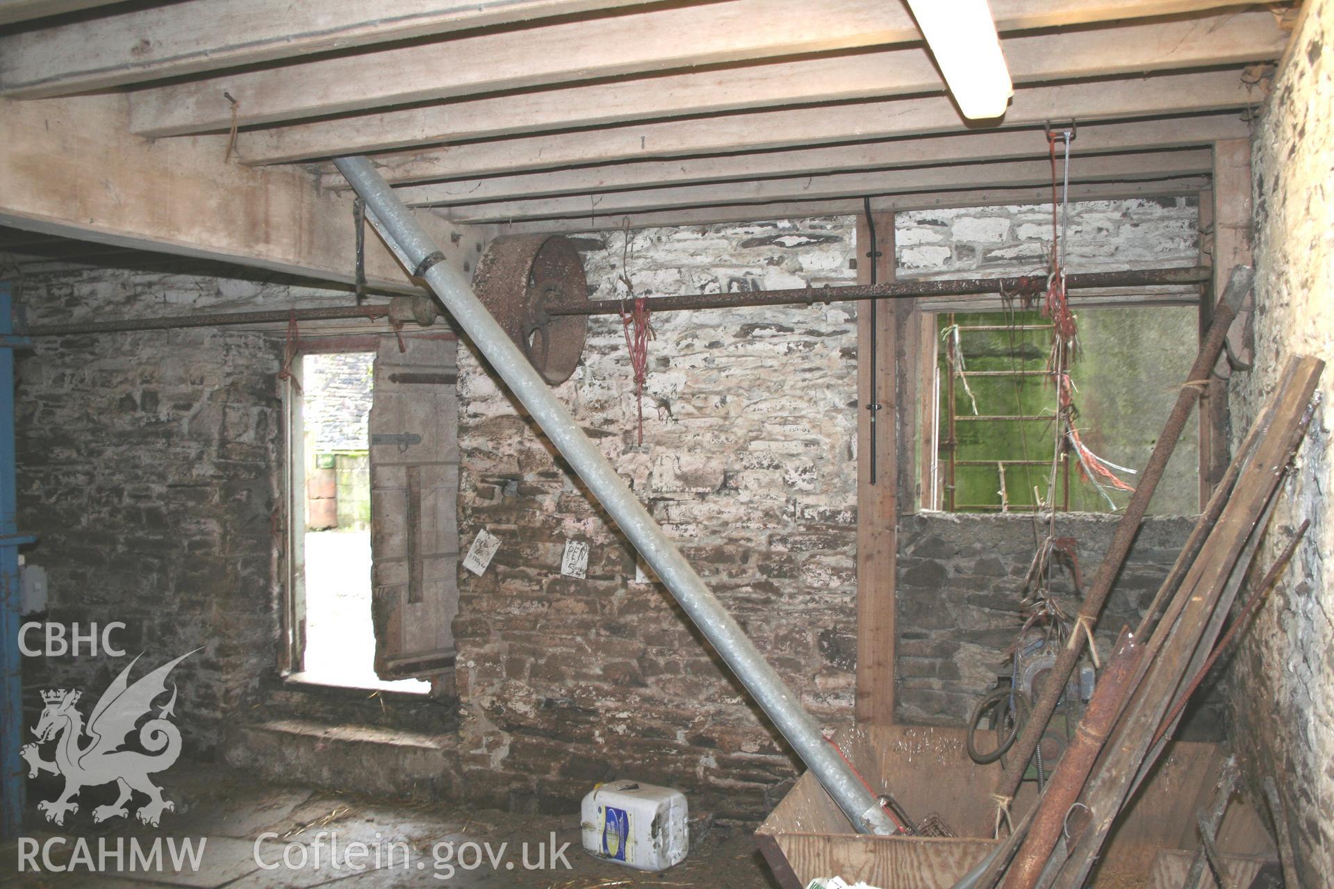 Interior view showing dissused iron machinery. Photographic survey of the threshing house, straw house, mixing house and root house at Tan-y-Graig Farm, Llanfarian, conducted by Geoff Ward and John Wiles, 11th December 2006.