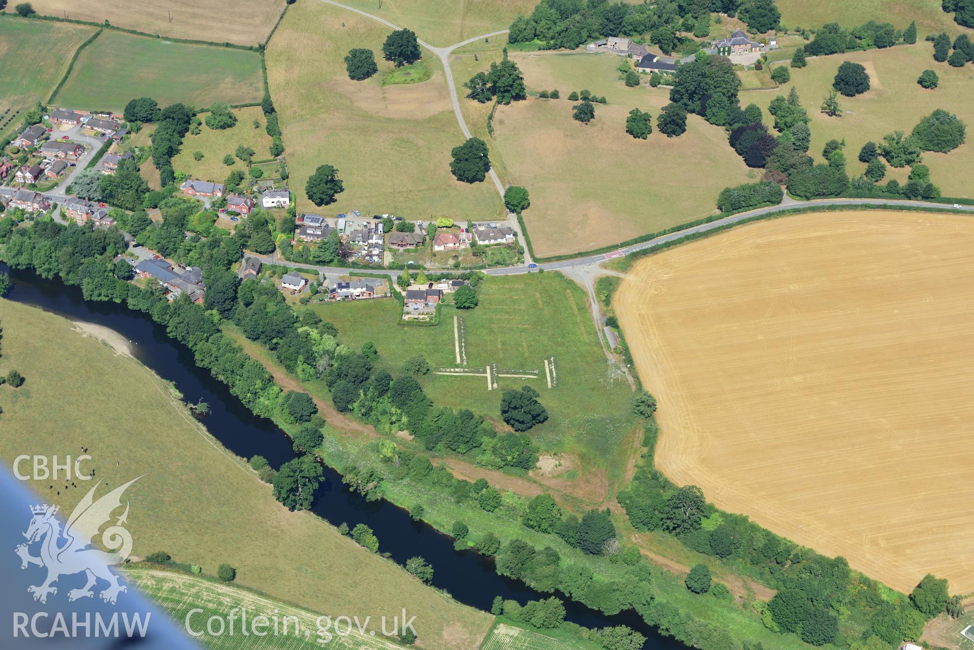 Royal Commission aerial photography of an archaeological evaluation by Trysor at SJ 230 205 in Llansanffraid ym mechain village, taken on 19th July 2018 during the 2018 drought.