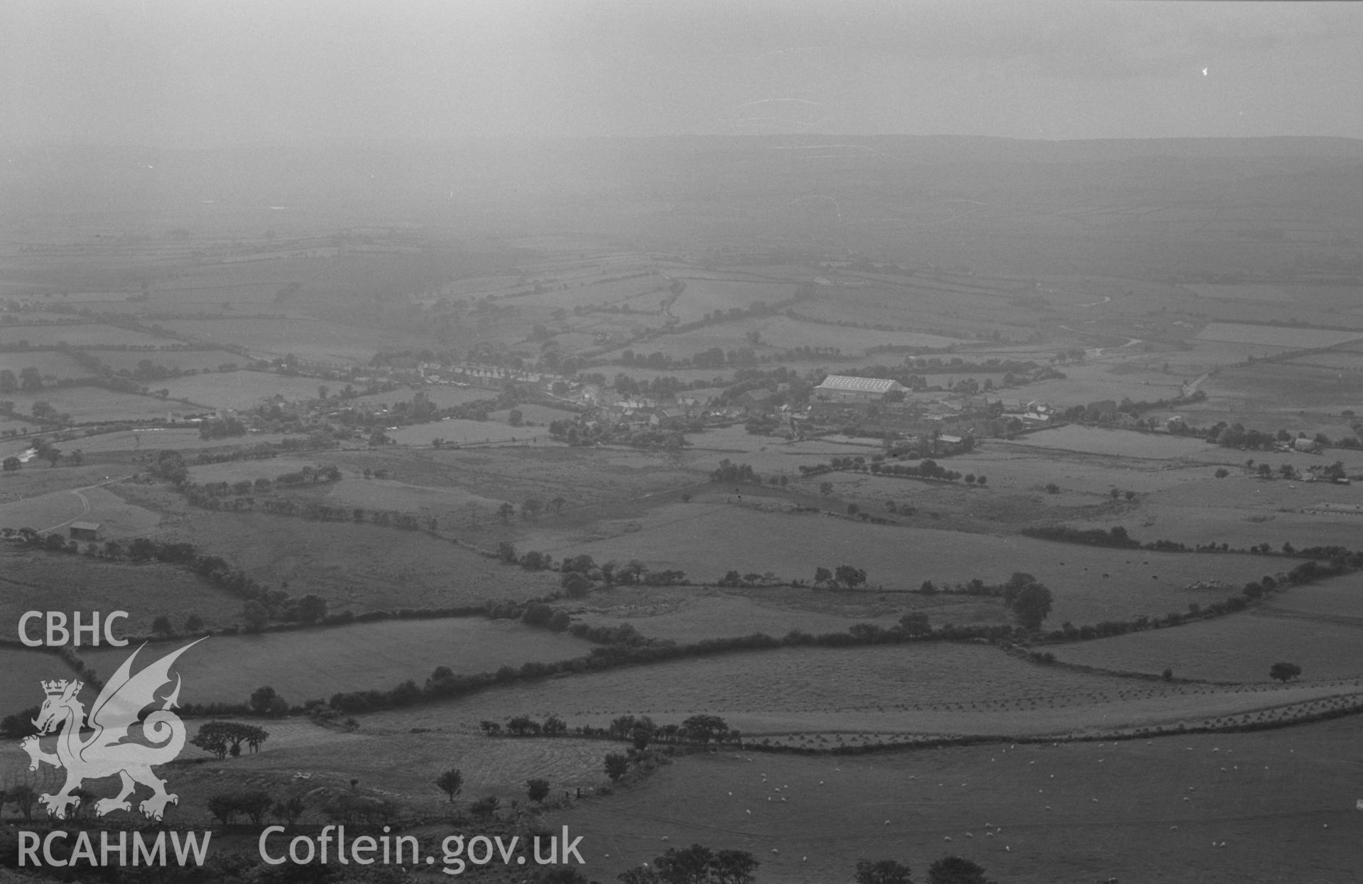 Digital copy of a black and white negative showing view from Pen-y-Bannau hill fort towards Pontrhydfendigaid. Photographed by Arthur O. Chater on 25th August 1967 looking west south west from Grid Reference SN 742 669.