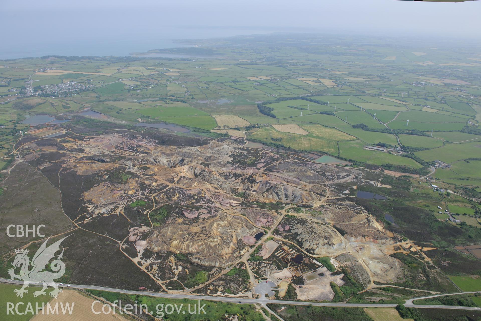 Parys Mountain copper mines, Amlwch, Anglesey. Oblique aerial photograph taken during the Royal Commission?s programme of archaeological aerial reconnaissance by Toby Driver on 12th July 2013.
