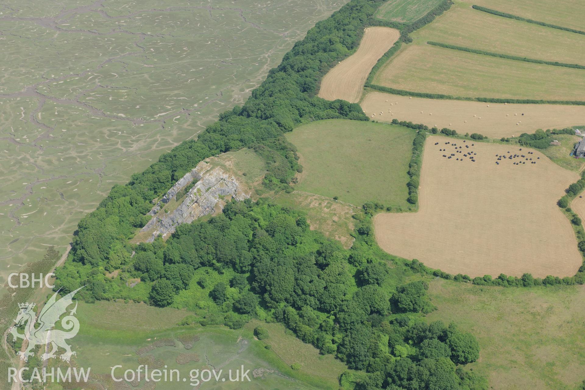North Hill Tor defended enclosure, on the Gower Peninsula. Oblique aerial photograph taken during the Royal Commission?s programme of archaeological aerial reconnaissance by Toby Driver on 16th July 2013.