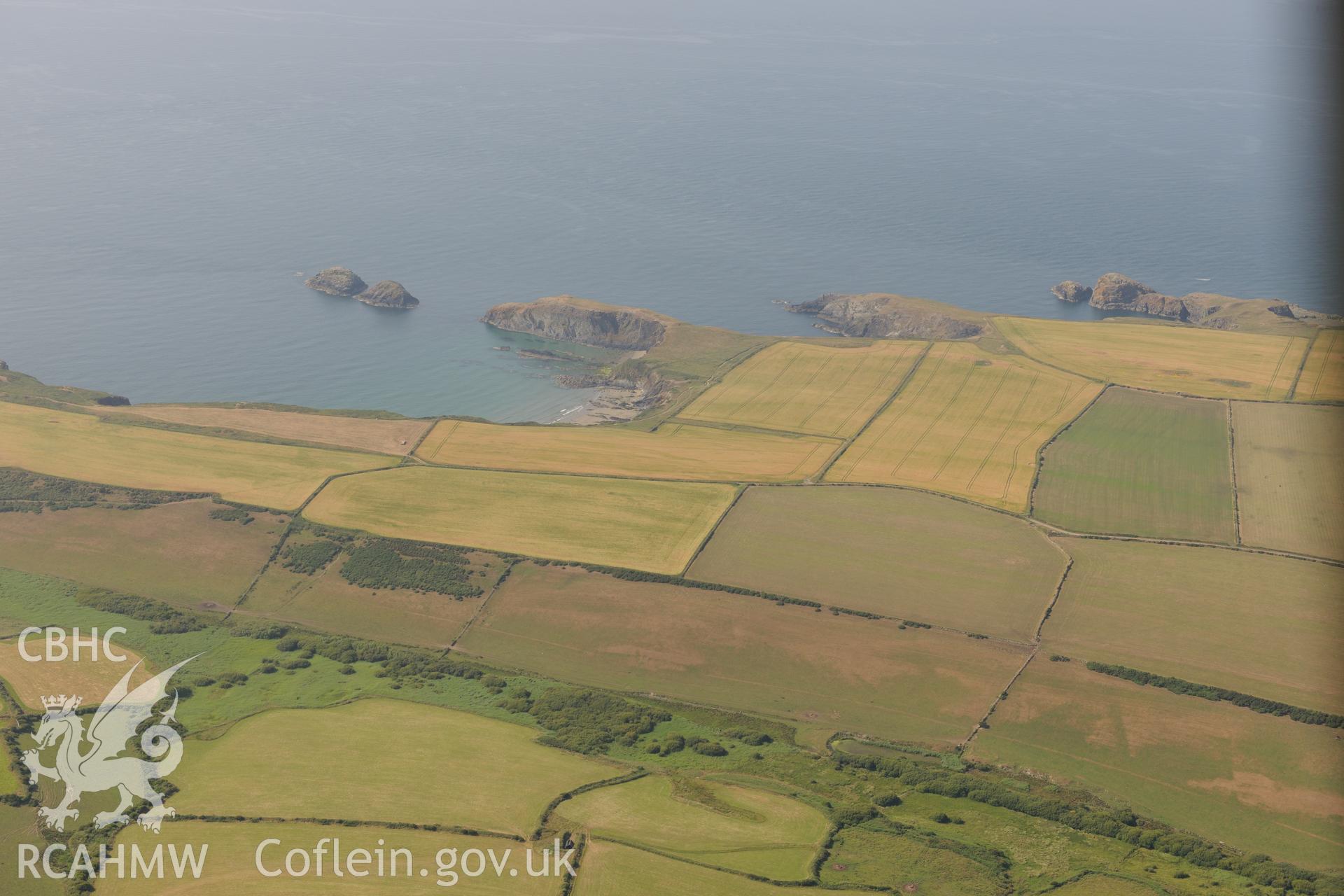 Porth-Egr Promontory Fort. Oblique aerial photograph taken during the Royal Commission?s programme of archaeological aerial reconnaissance by Toby Driver on 16th July 2013.