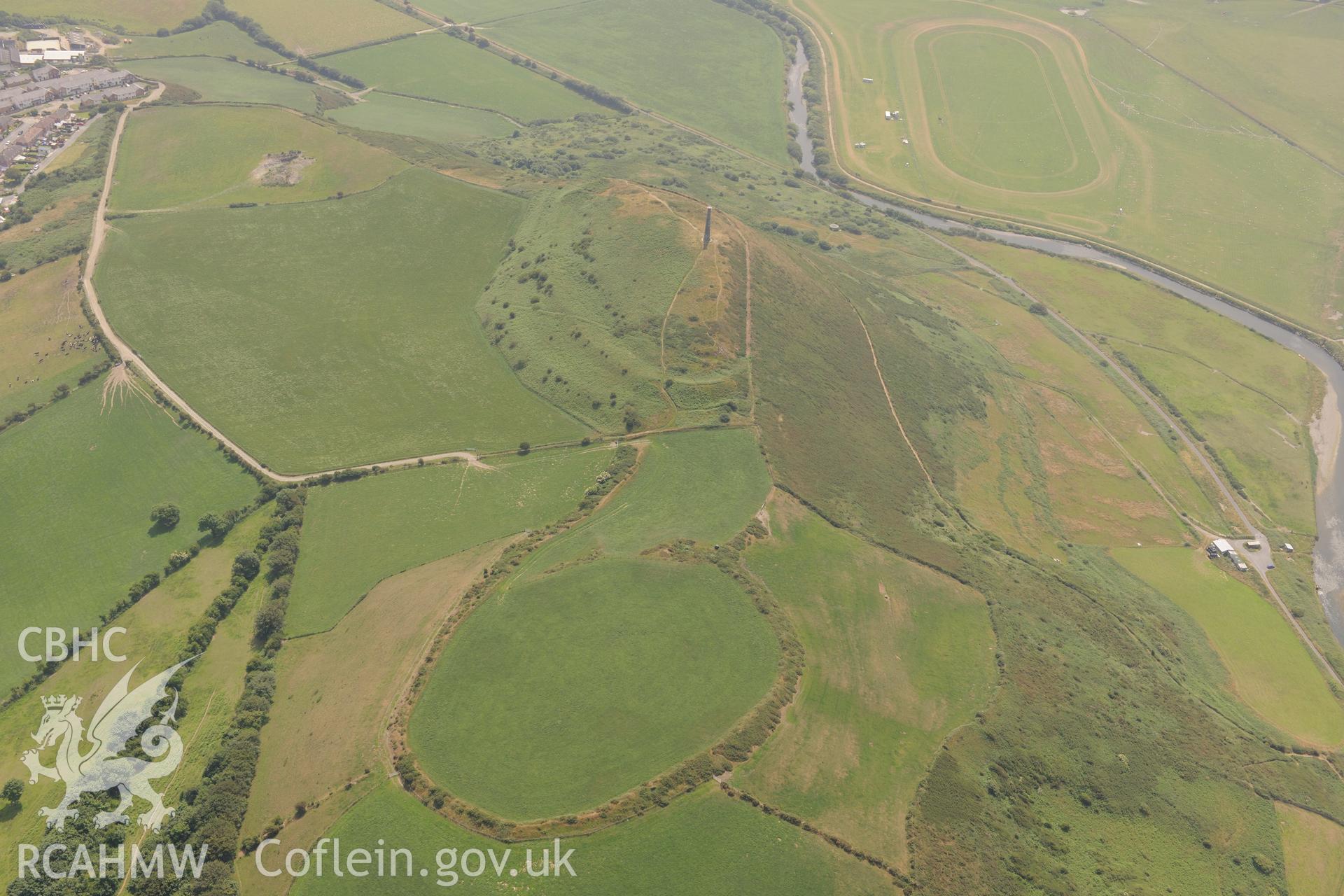Ceredigion Trotting Circuit at Tan y Castell, the Wellington Monument and Pendinas Hillfort, Aberystwyth. Oblique aerial photograph taken during the Royal Commission?s programme of archaeological aerial reconnaissance by Toby Driver on 12th July 2013.