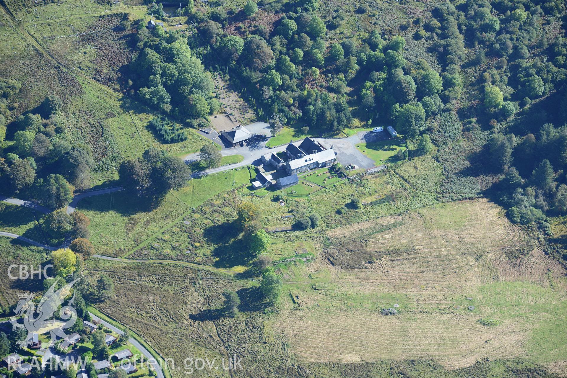 Circular tent bases at the former Trawsfynydd military camp, and Rhiw Goch house, Bronaber. Oblique aerial photograph taken during the Royal Commission's programme of archaeological aerial reconnaissance by Toby Driver on 2nd October 2015.