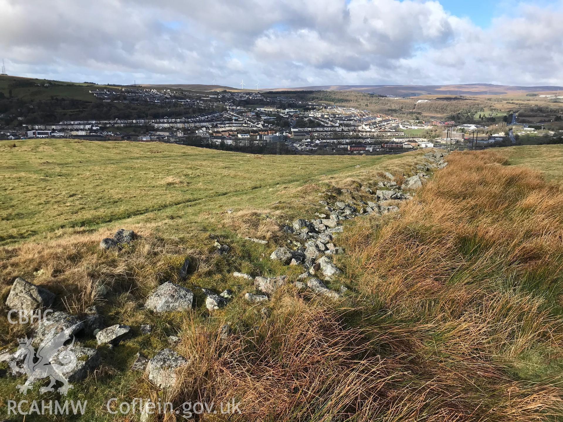 Colour photograph of boundary wall of house platform and field system at Bwlch y Garn, Ebbw Vale, taken by Paul R. Davis on 17th March 2019.