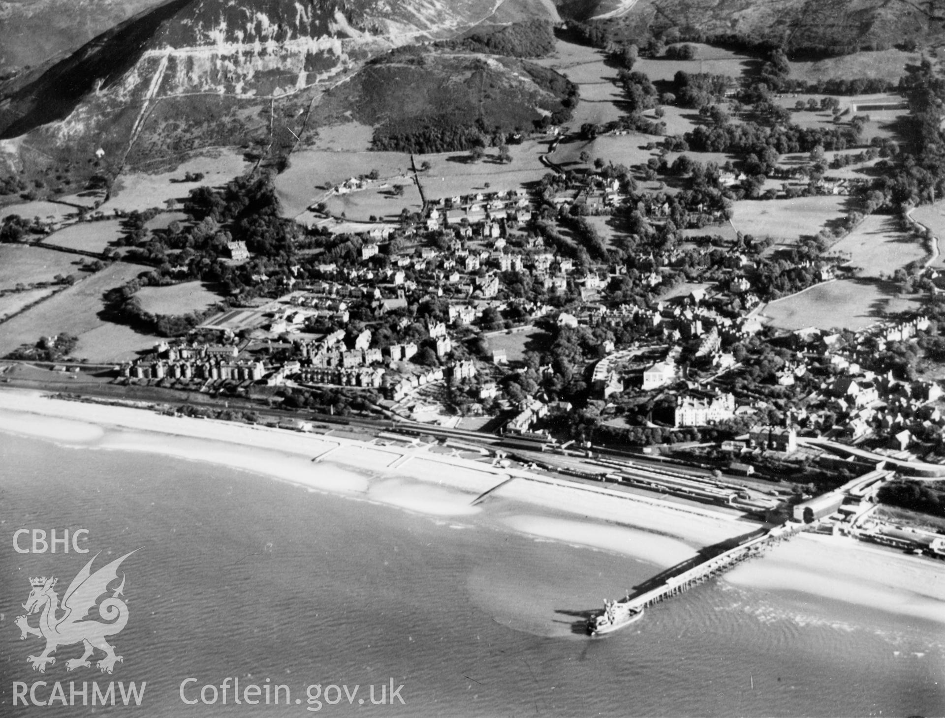View of Penmaenmawr showing jetty. Oblique aerial photograph, 5?x4? BW glass plate.