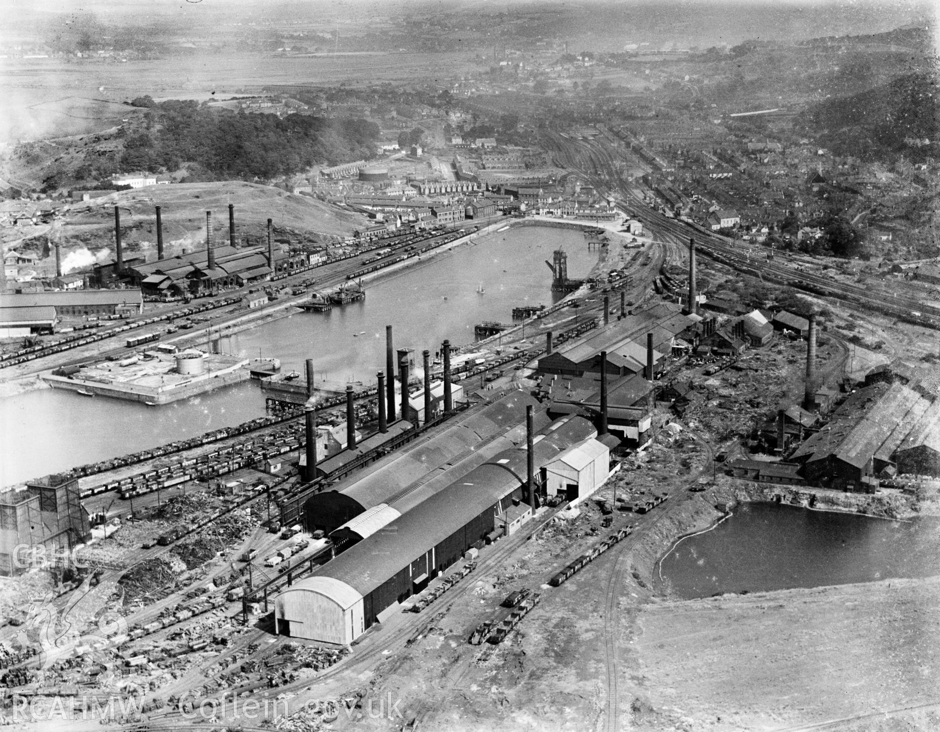 View of Briton Ferry showing the docks and steelworks, oblique aerial view. 5?x4? black and white glass plate negative.