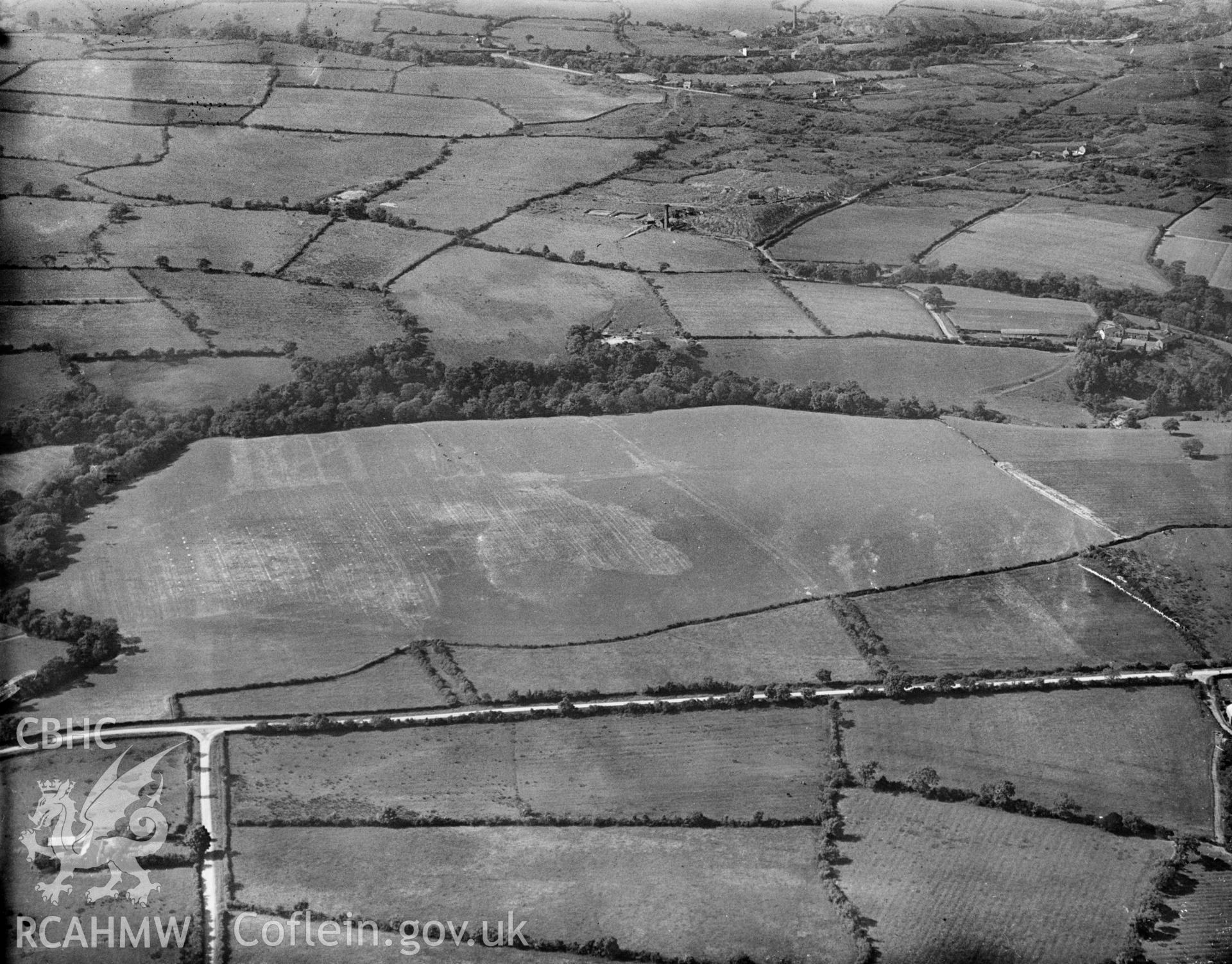 View of Rhos Uchaf aerodrome with Tan-Llan colliery in the distance. Oblique aerial photograph, 5?x4? BW glass plate.