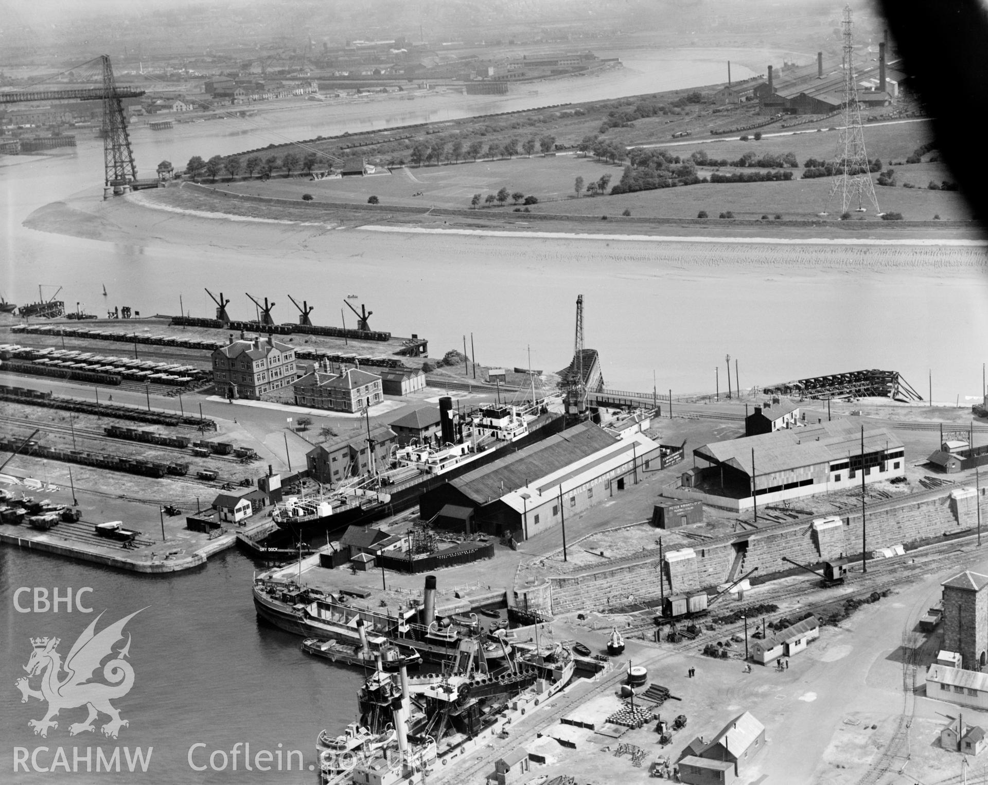 View of a ship in dry dock,  Newport, oblique aerial view. 5?x4? black and white glass plate negative.