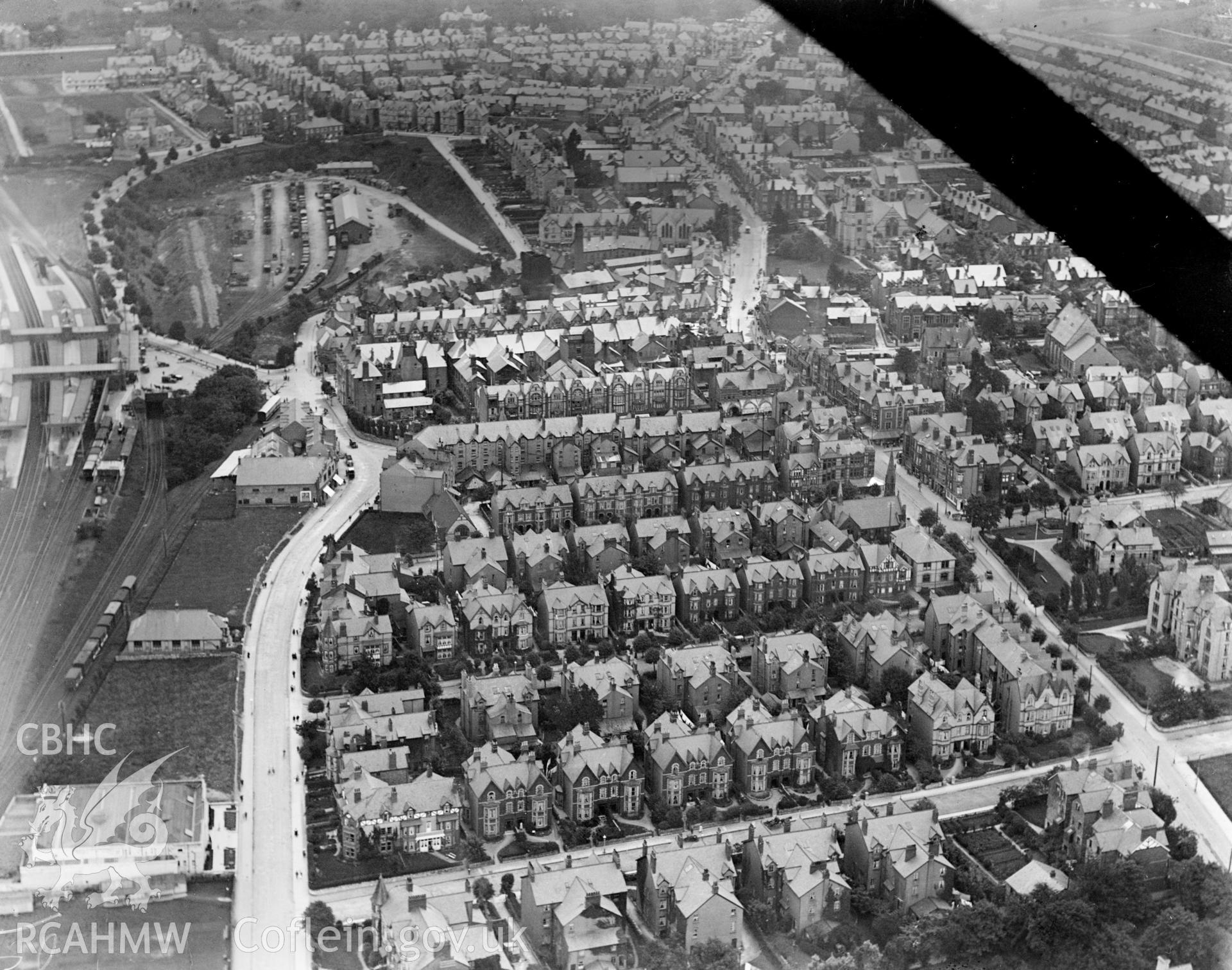 View of Colwyn Bay showing railway station and residential area, oblique aerial view. 5?x4? black and white glass plate negative.