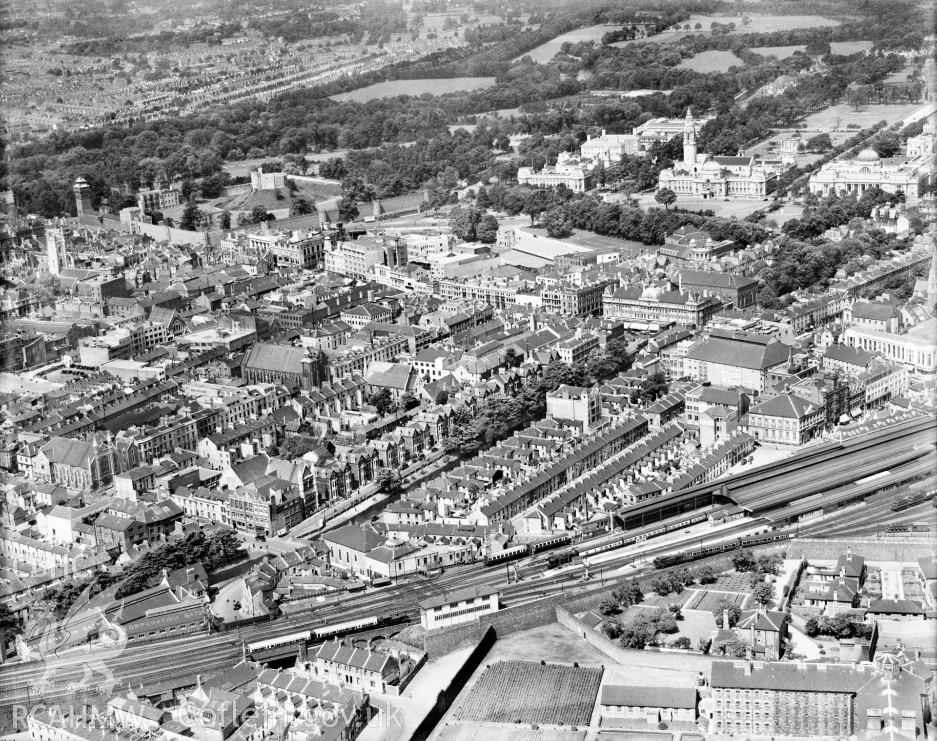 View of central Cardiff showing Cardiff Queen Street station, oblique aerial view. 51/2x41/2" black and white glass plate negative.