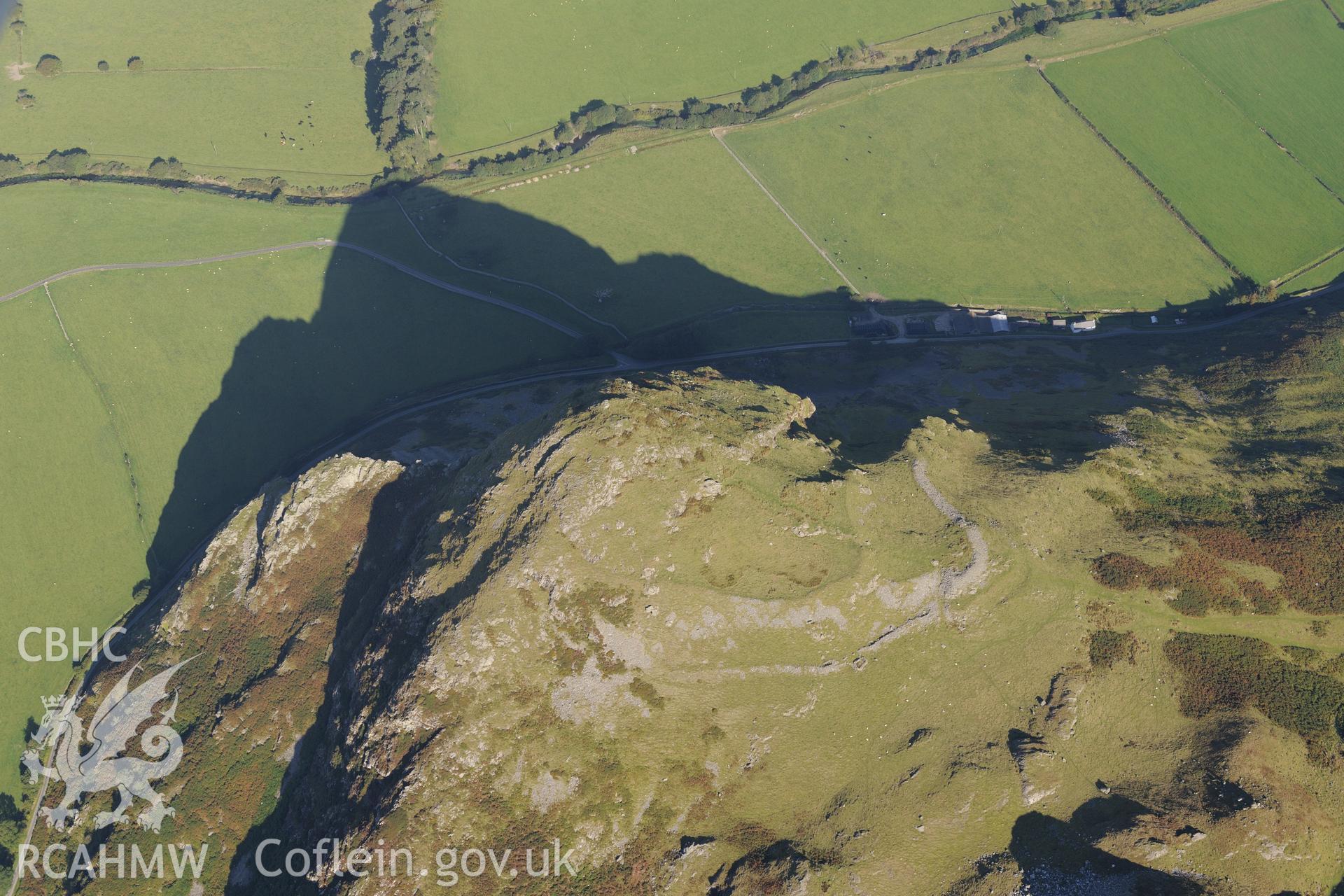 Hillfort on Bird's Rock, near Abergynolwyn. Oblique aerial photograph taken during the Royal Commission's programme of archaeological aerial reconnaissance by Toby Driver on 2nd October 2015.