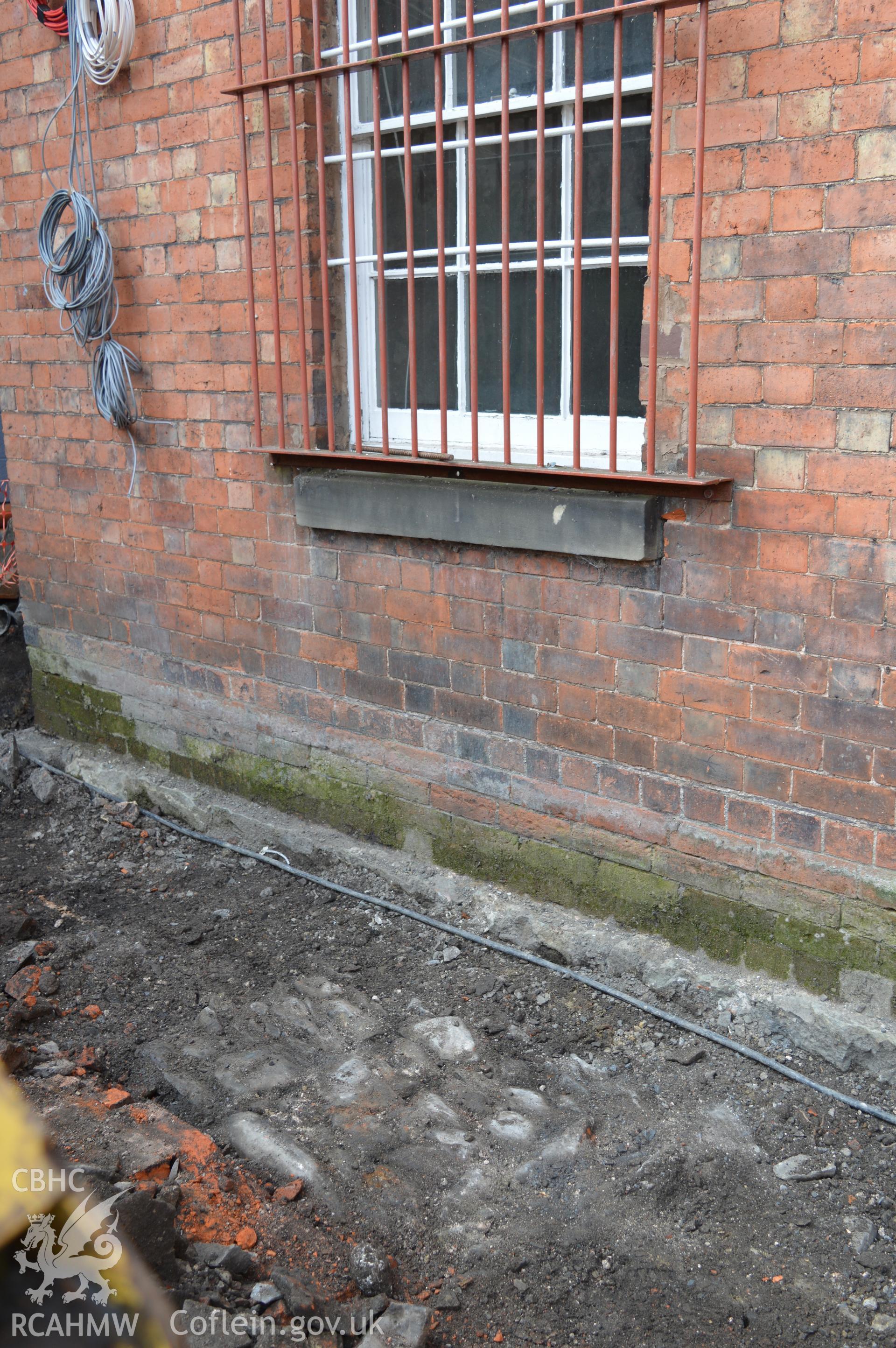 Digital colour photograph showing view from the north showing cobbled surface. Photographed as part of CPAT Project 2351: 2 Severn Street, Welshpool, Powys - Archaeological Watching Brief, 2019. Report no. 1663.