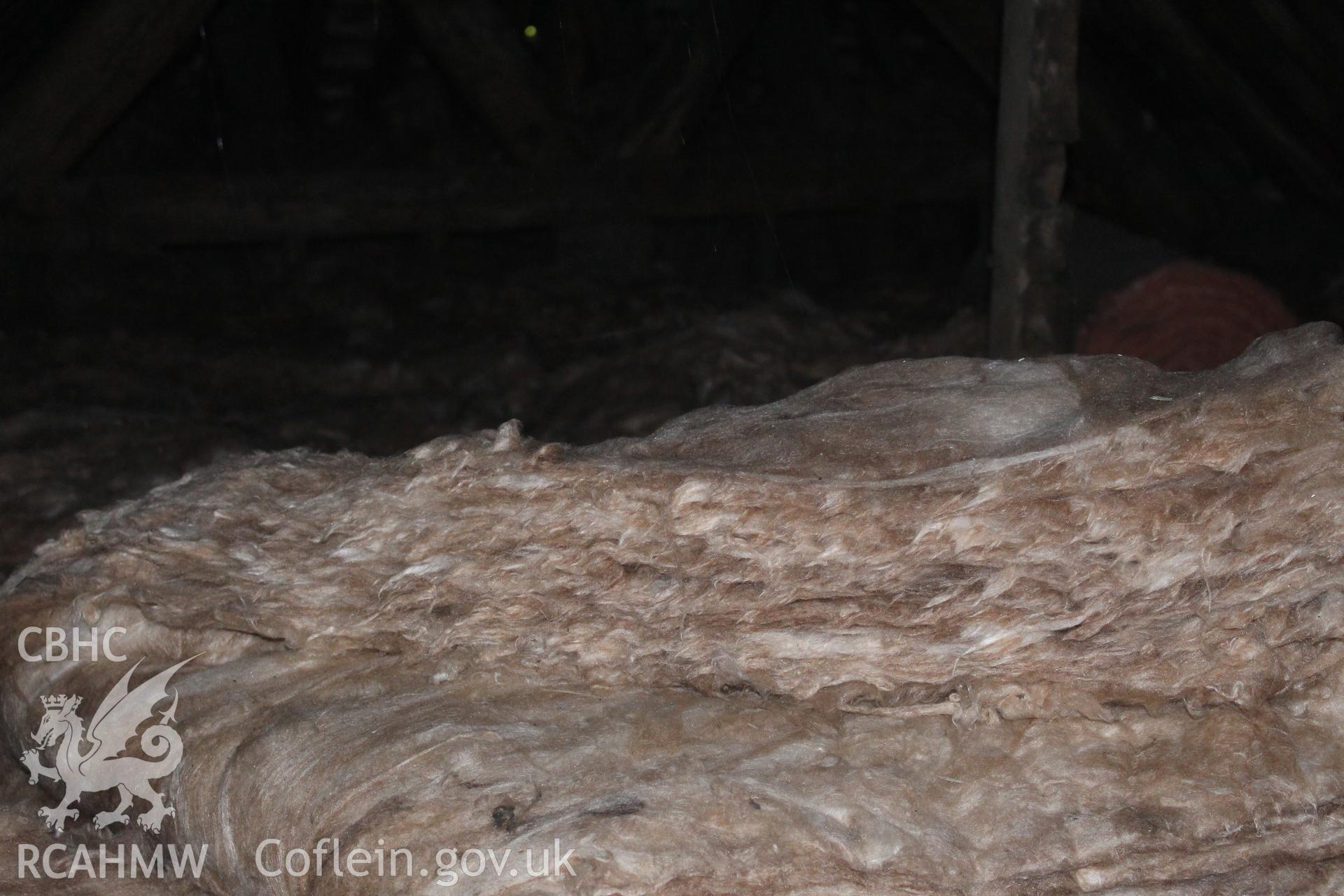 Colour photograph showing detail of insulating wool at 5-7 Mwrog Street, Ruthin. Photographed during survey conducted by Geoff Ward on 14th May 2014.