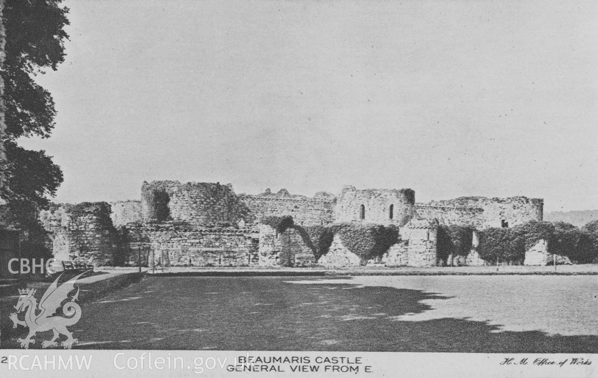 Digital copy of a postcard showing a general view of Beaumaris Castle from the east.