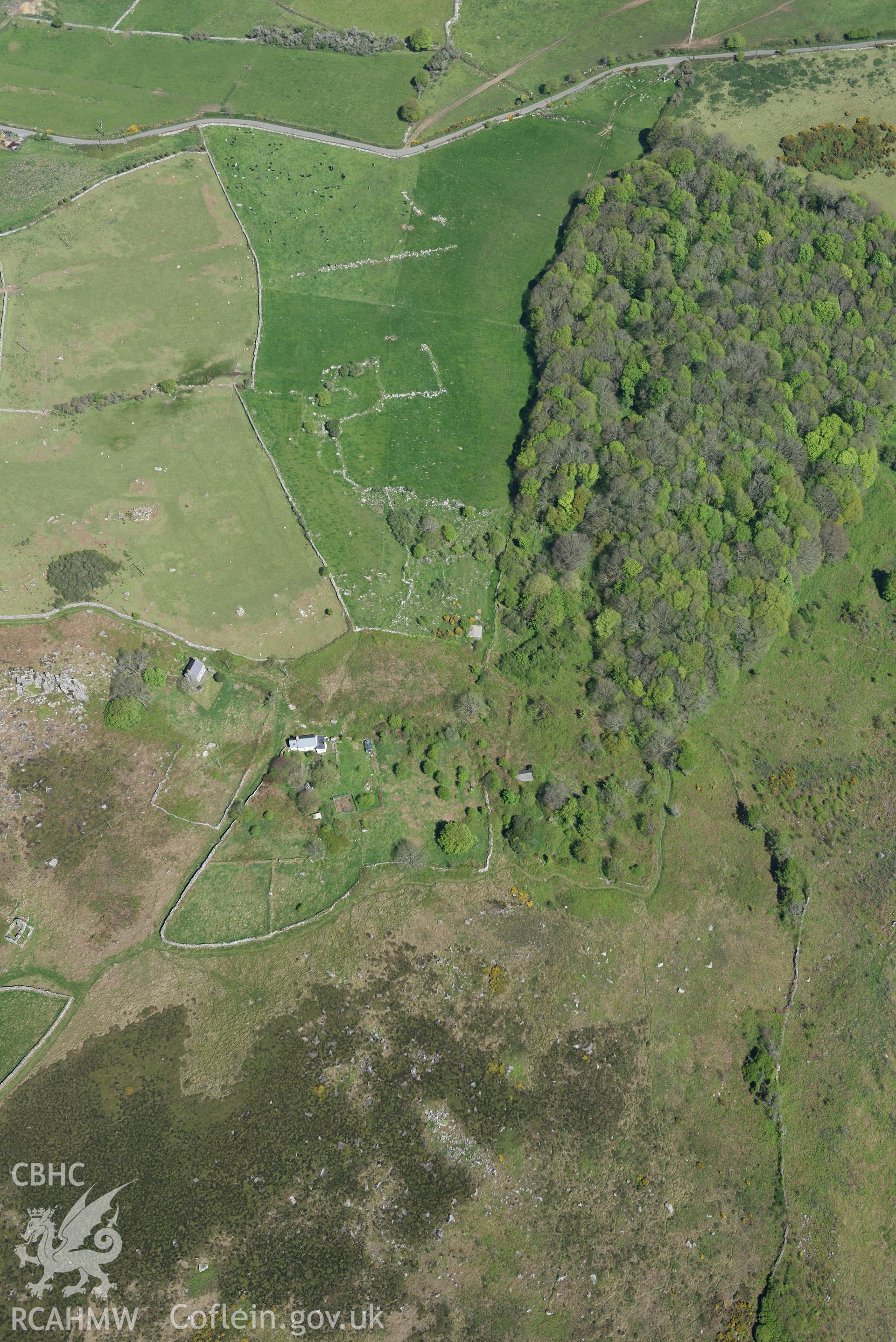 Aerial photography of Hut circle and fields south of Rhiw, taken on 3rd May 2017.  Baseline aerial reconnaissance survey for the CHERISH Project. ? Crown: CHERISH PROJECT 2017. Produced with EU funds through the Ireland Wales Co-operation Programme 2014-2020. All material made freely available through the Open Government Licence.