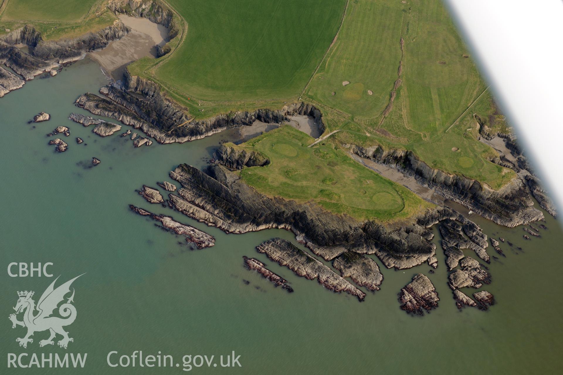 Royal Commission aerial photograph of Gwbert promontory fort taken on 27th March 2017. Baseline aerial reconnaissance survey for the CHERISH Project. ? Crown: CHERISH PROJECT 2017. Produced with EU funds through the Ireland Wales Co-operation Programme 2014-2020. All material made freely available through the Open Government Licence.