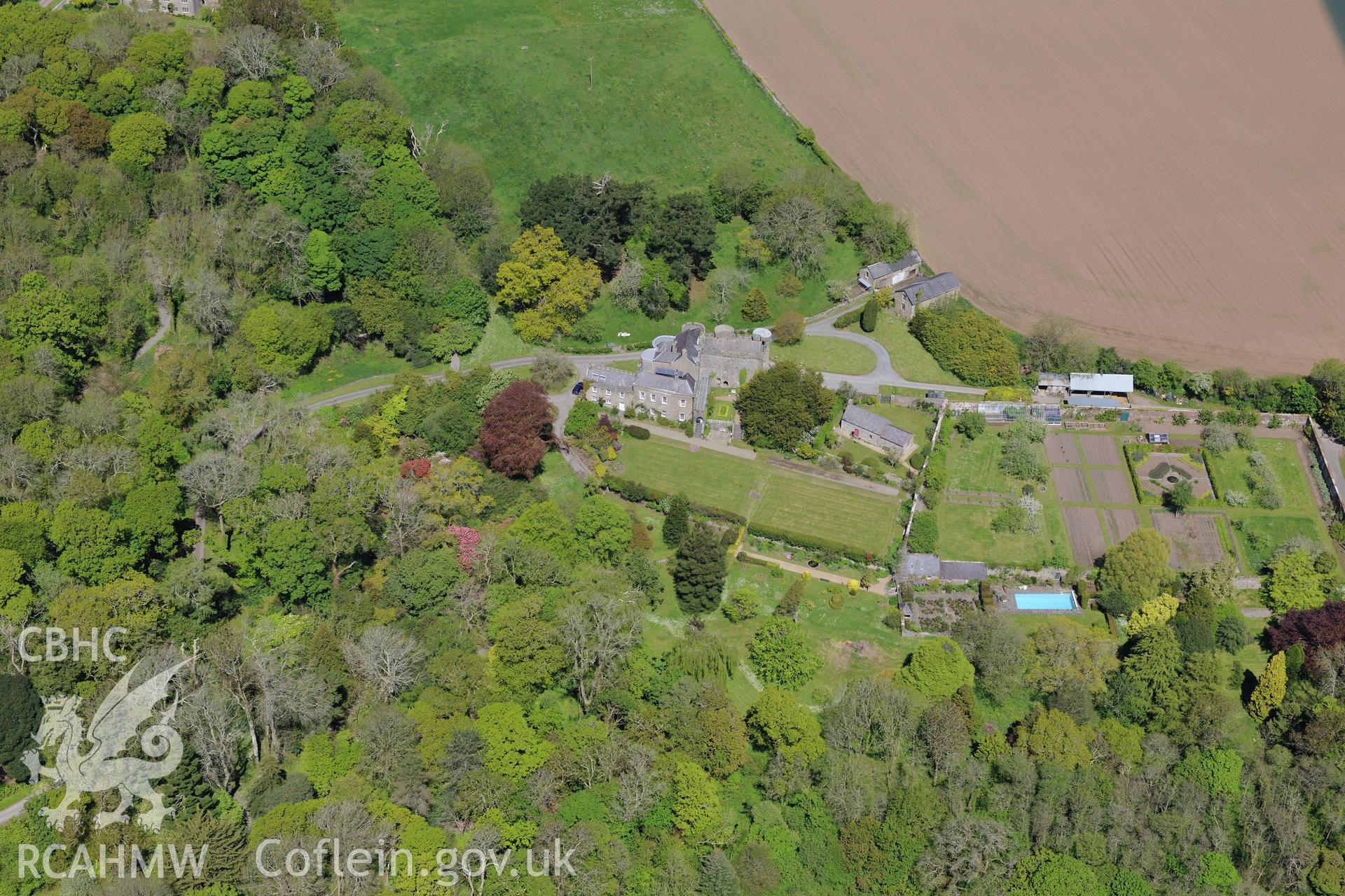 Upton Castle and Gardens, and Upton Chapel, near Cosheston, Pembroke Dock. Oblique aerial photograph taken during the Royal Commission's programme of archaeological aerial reconnaissance by Toby Driver on 13th May 2015.