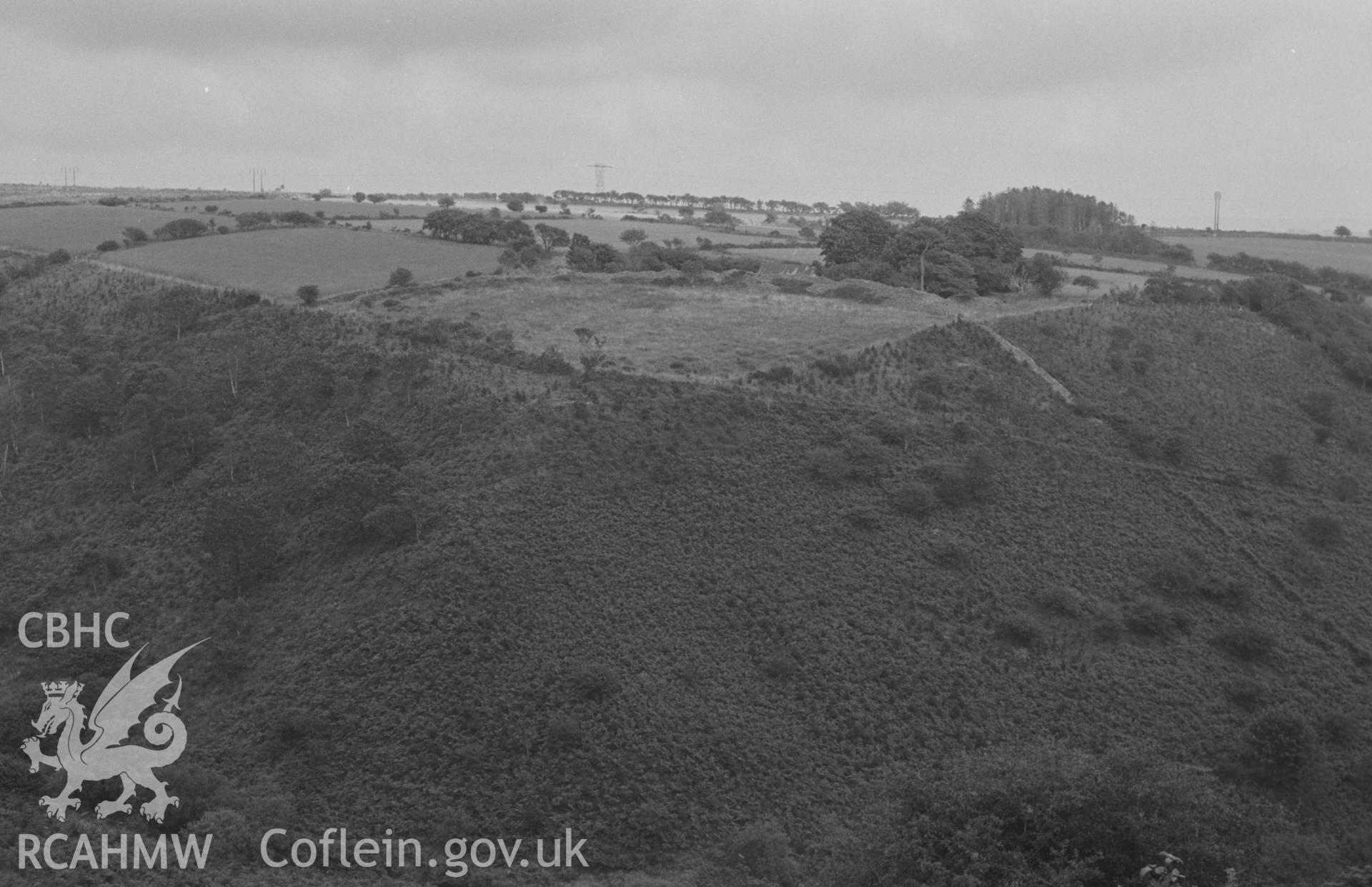 Digital copy of a black and white negative showing Carn Wen promontory iron-age camp, 2.3km east of Ffostrasol, rampart is a quarter-circle dry stone bank. Photographed by Arthur O. Chater in August 1967. (View looking east from Grid Reference SN 394 471).