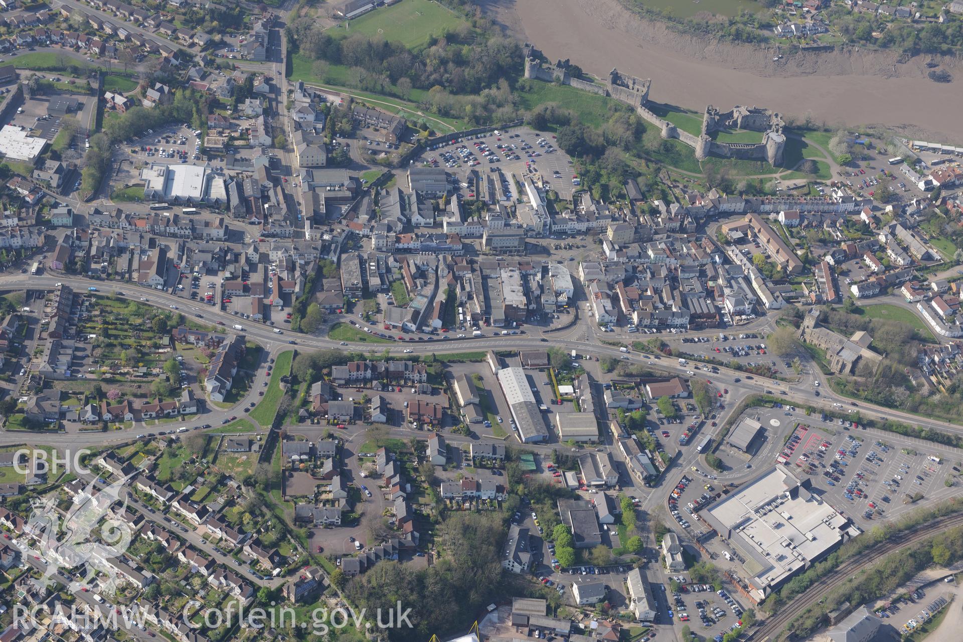 Chepstow including the Castle, St. Mary's Church, the Old Almshouses, the Town Wall and the Palace Theatre. Oblique aerial photograph taken during the Royal Commission's programme of archaeological aerial reconnaissance by Toby Driver on 21st April 2015.