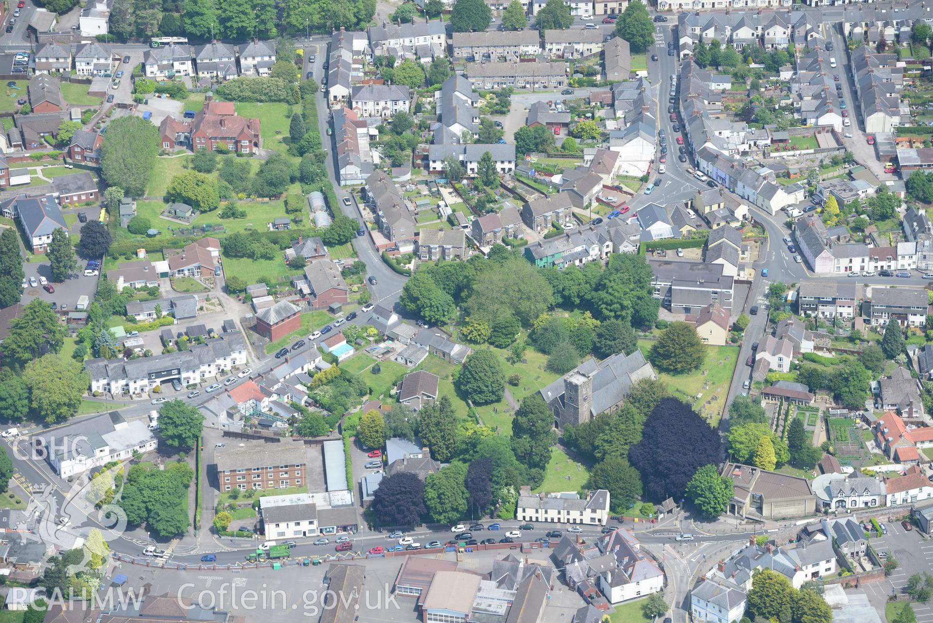 Caerleon town including views of the Roman barracks; Caerleon Roman Legionary Museum and St. Cadock's Church. Oblique aerial photograph taken during the Royal Commission?s programme of archaeological aerial reconnaissance by Toby Driver on 11th June 2015.