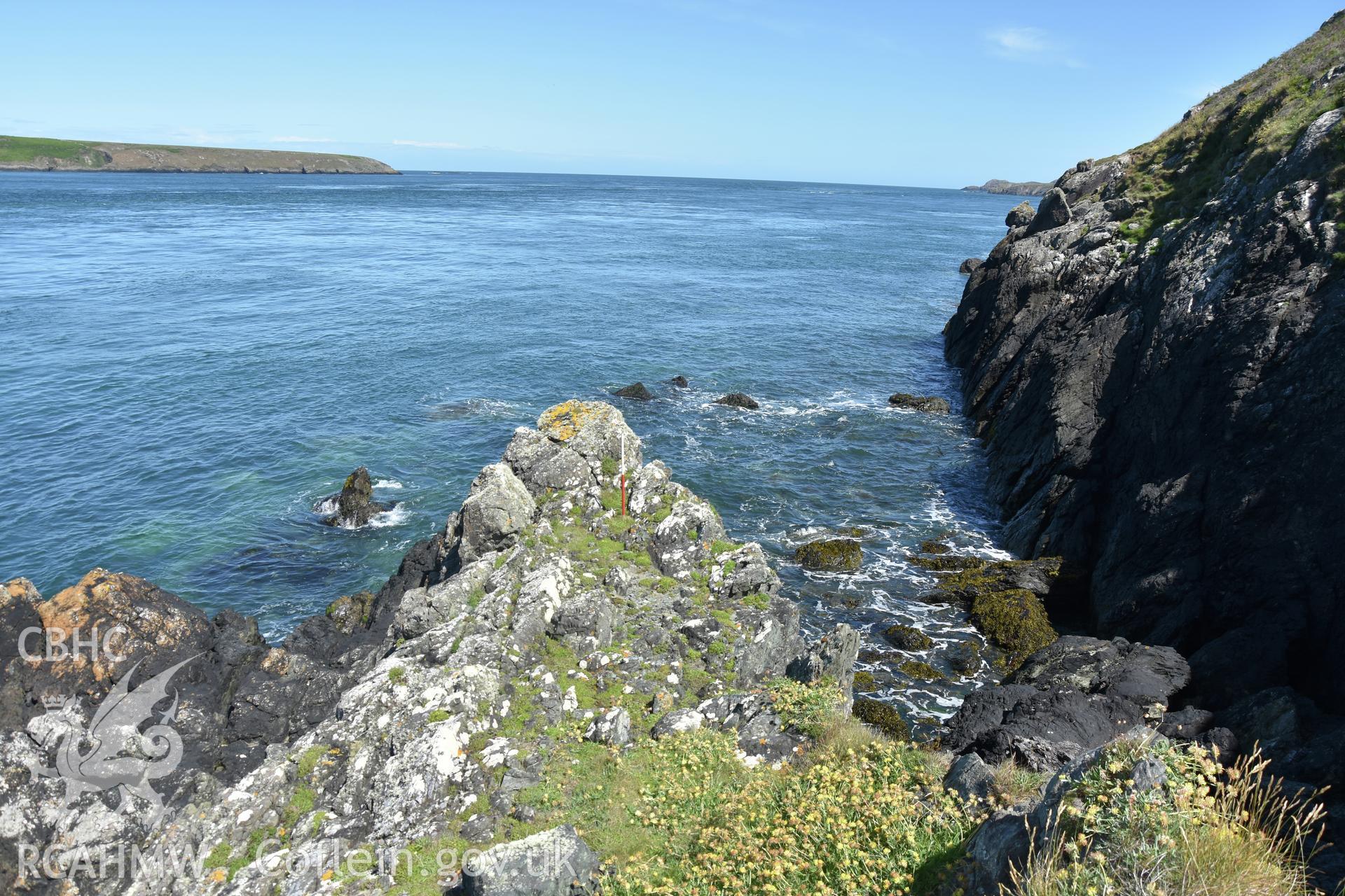 Penmaenmelyn copper mine. View of potential rock 'jetty' at north end of mine, with 1m scale. Investigator?s photographic survey for the CHERISH Project. ? Crown: CHERISH PROJECT 2019. Produced with EU funds through the Ireland Wales Co-operation Programme 2014-2020. All material made freely available through the Open Government Licence.